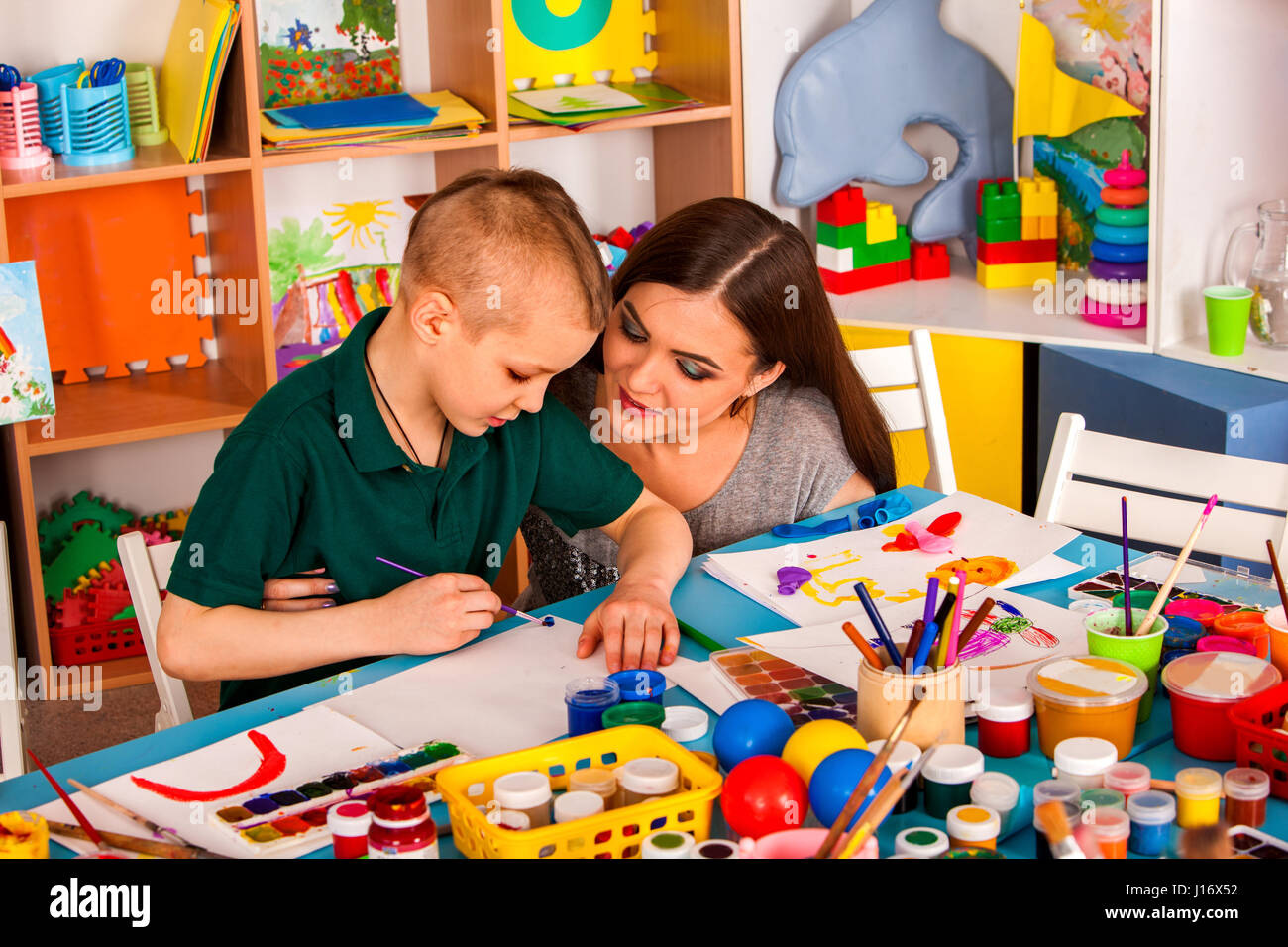Small students girl and boy painting in art school class Stock Photo ...