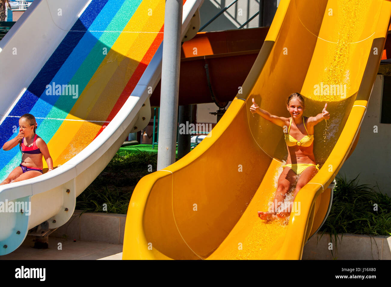 Swimming pool slides for children on water slide at aquapark Stock Photo -  Alamy