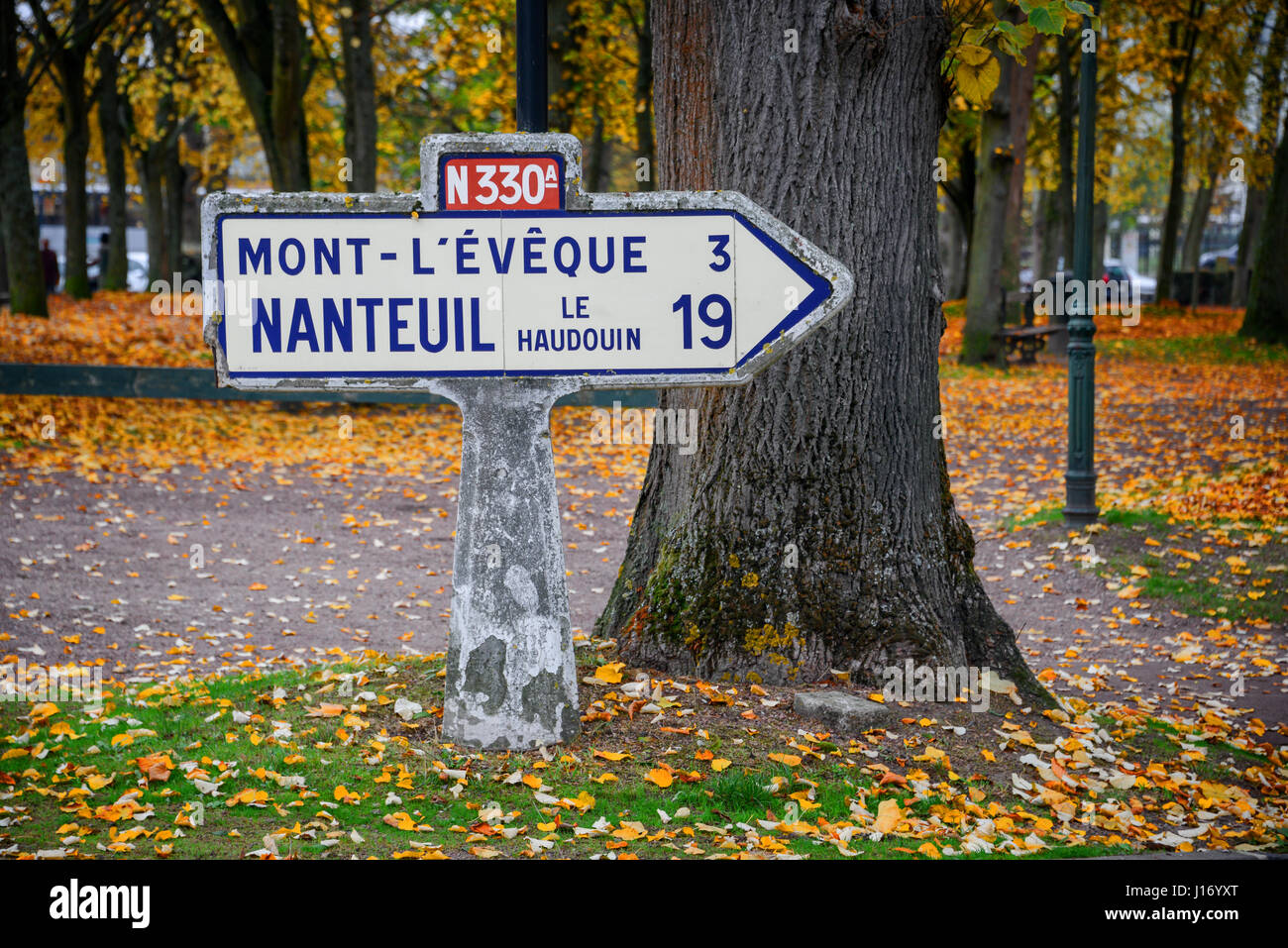 Vintage roadsign in France, autumnal background Stock Photo