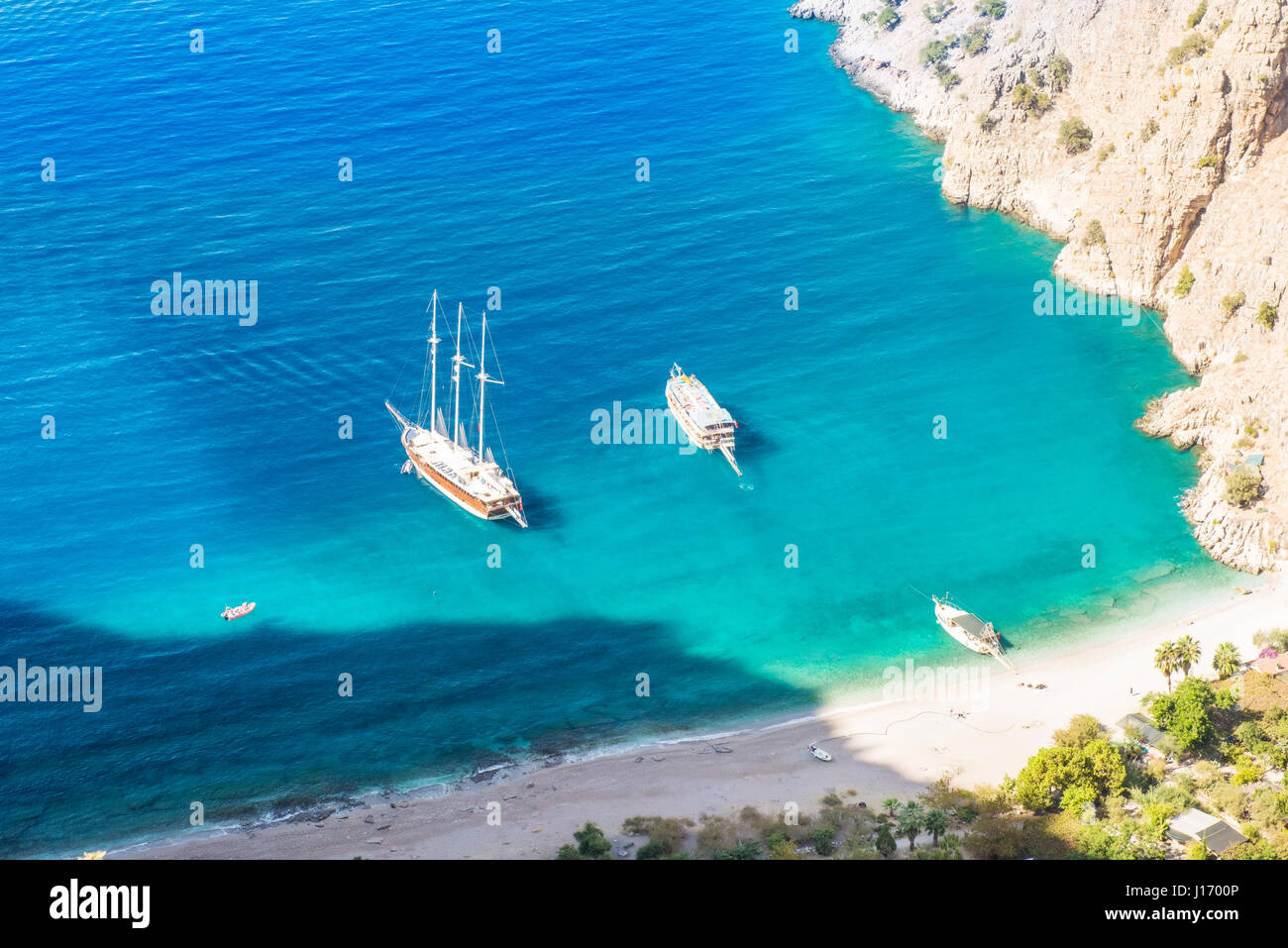 Summer butterfly valley sea beach view and cruise boat Oludeniz,Turkey Stock Photo