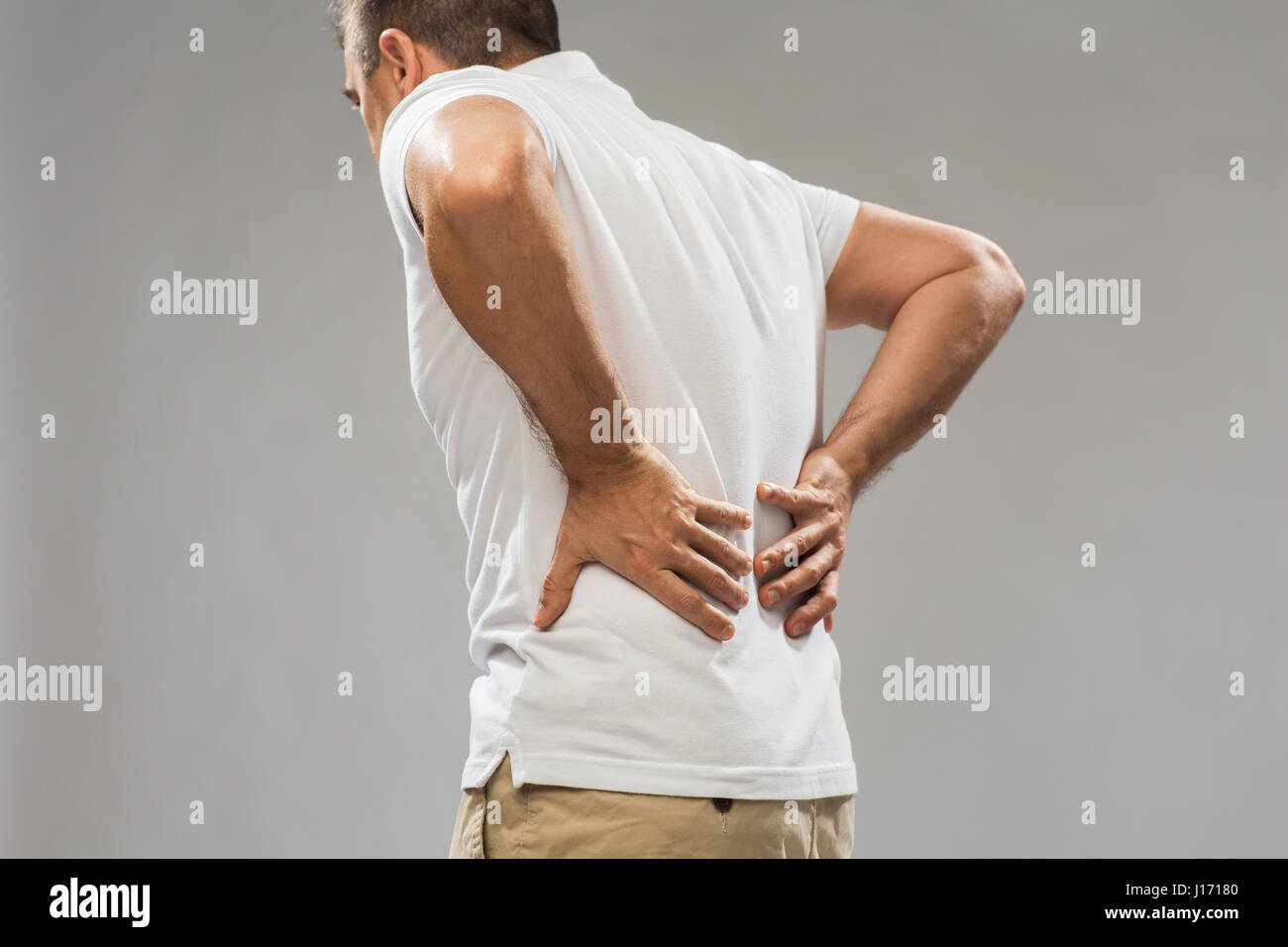 close up of man suffering from backache Stock Photo
