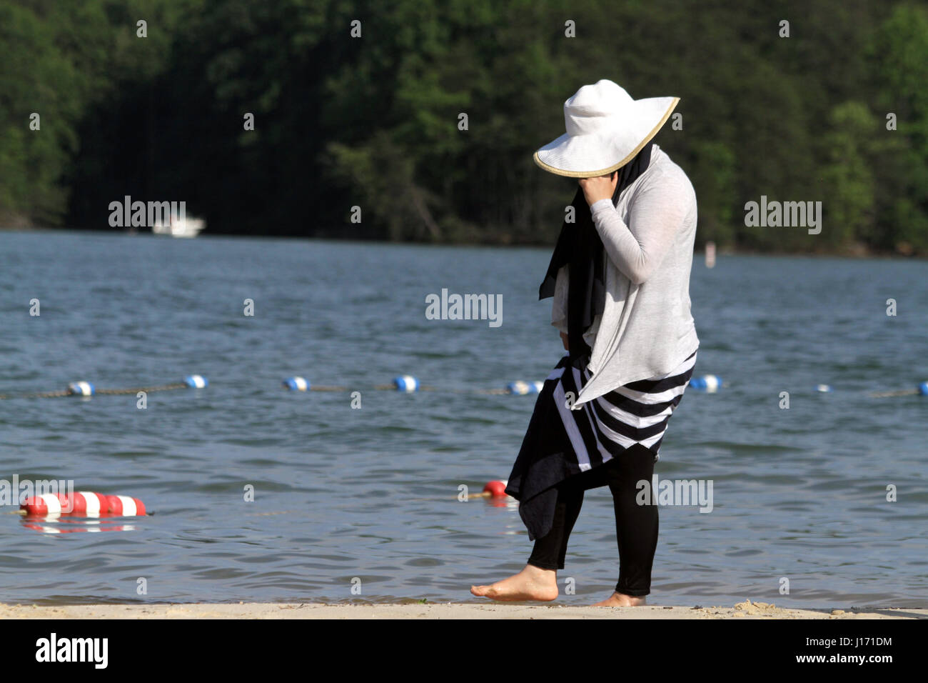 Muslim woman on the beach Stock Photo