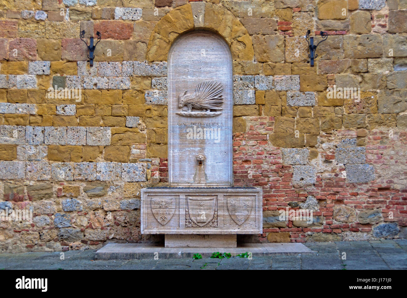 The stone fountain of Contrada Sovrana dell’Istrice - Siena, Italy Stock Photo