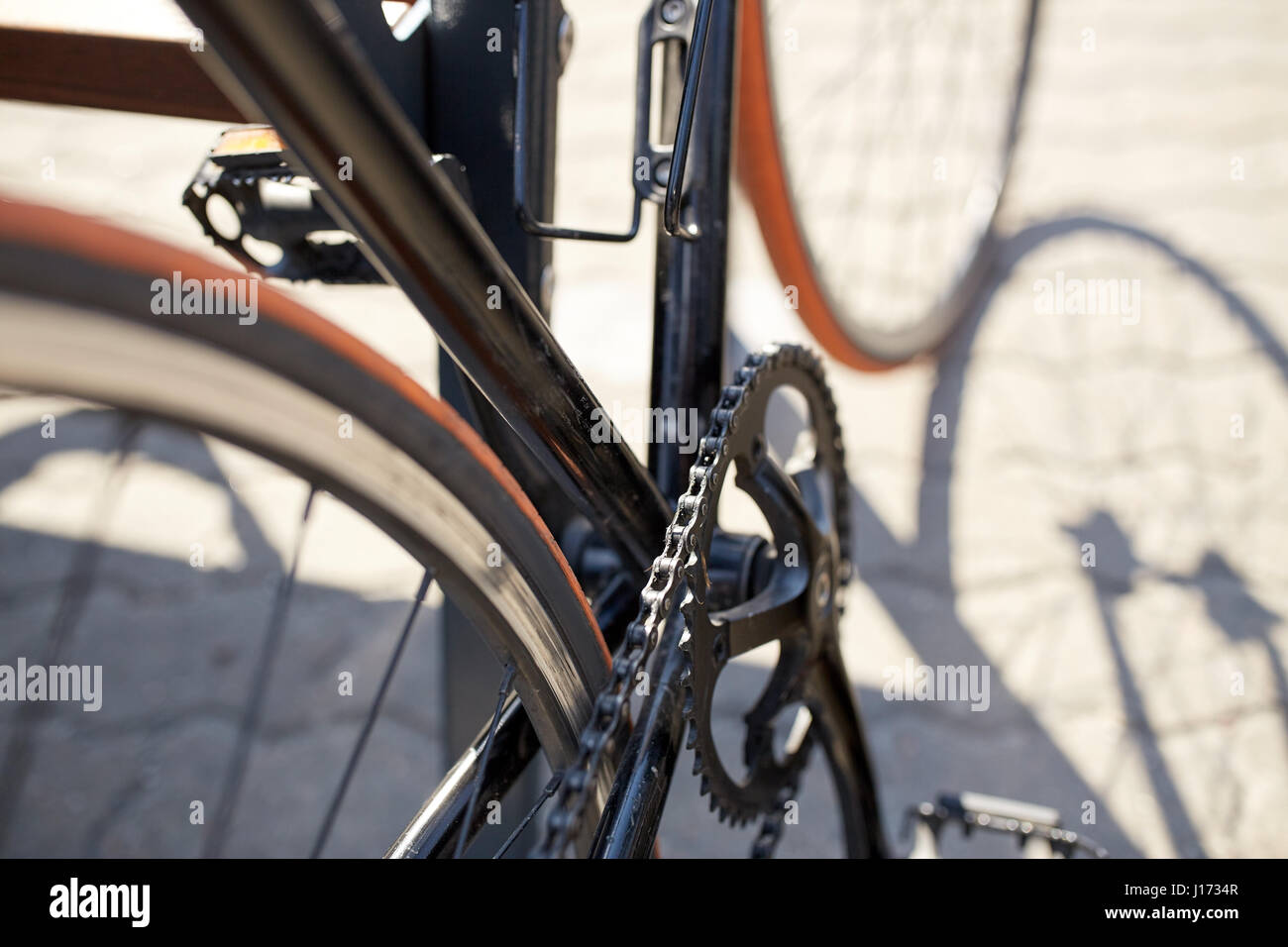 close up of fixed gear bicycle on city street Stock Photo