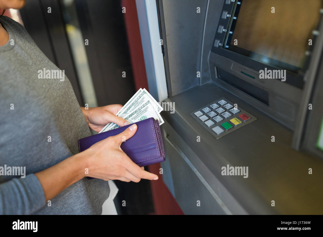 close up of hand withdrawing money at atm machine Stock Photo