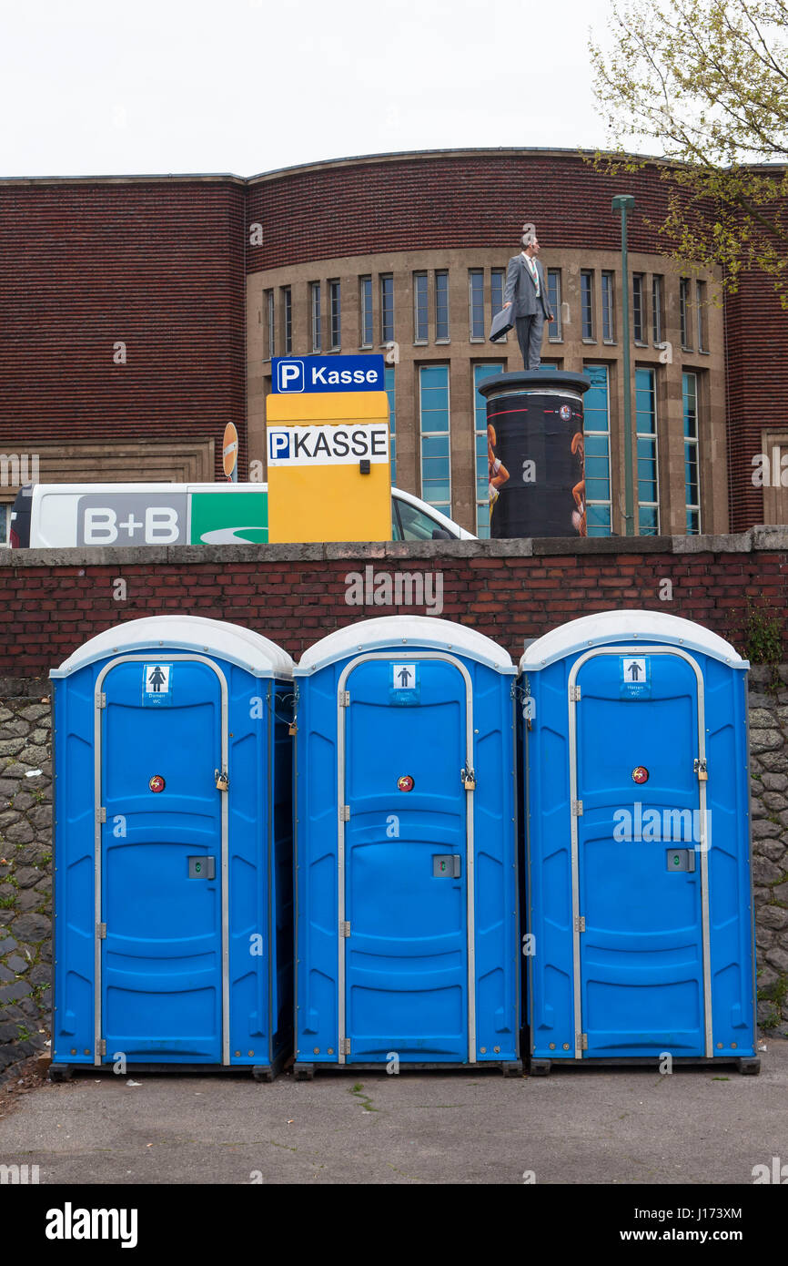 Europe, Germany, Duesseldorf, mobile toilets on the banks of the river Rhine. Stock Photo