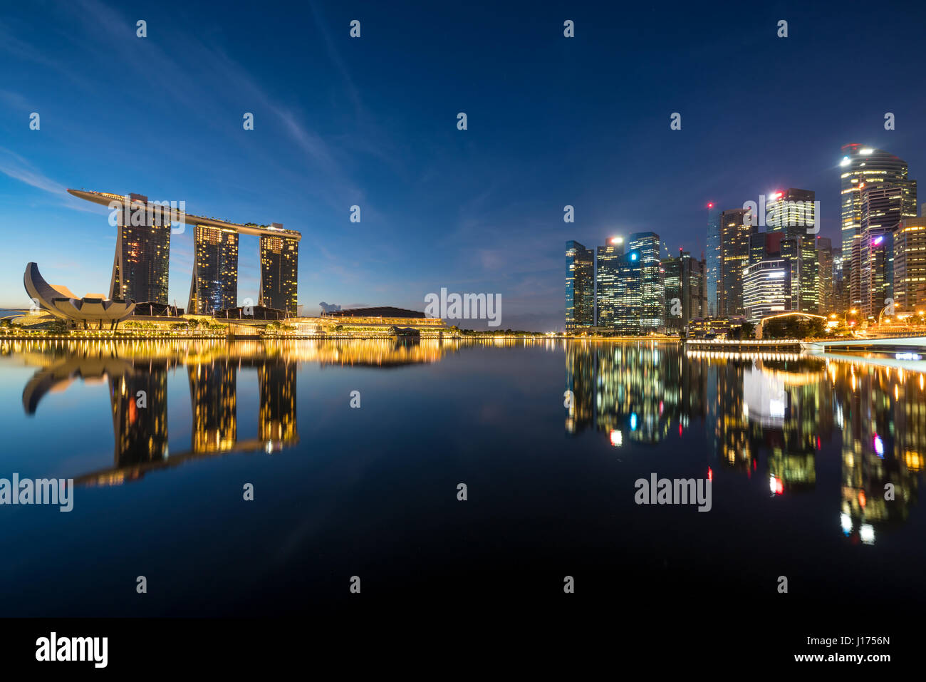 Singapore business district skyline in night at Marina Bay, Singapore. Stock Photo