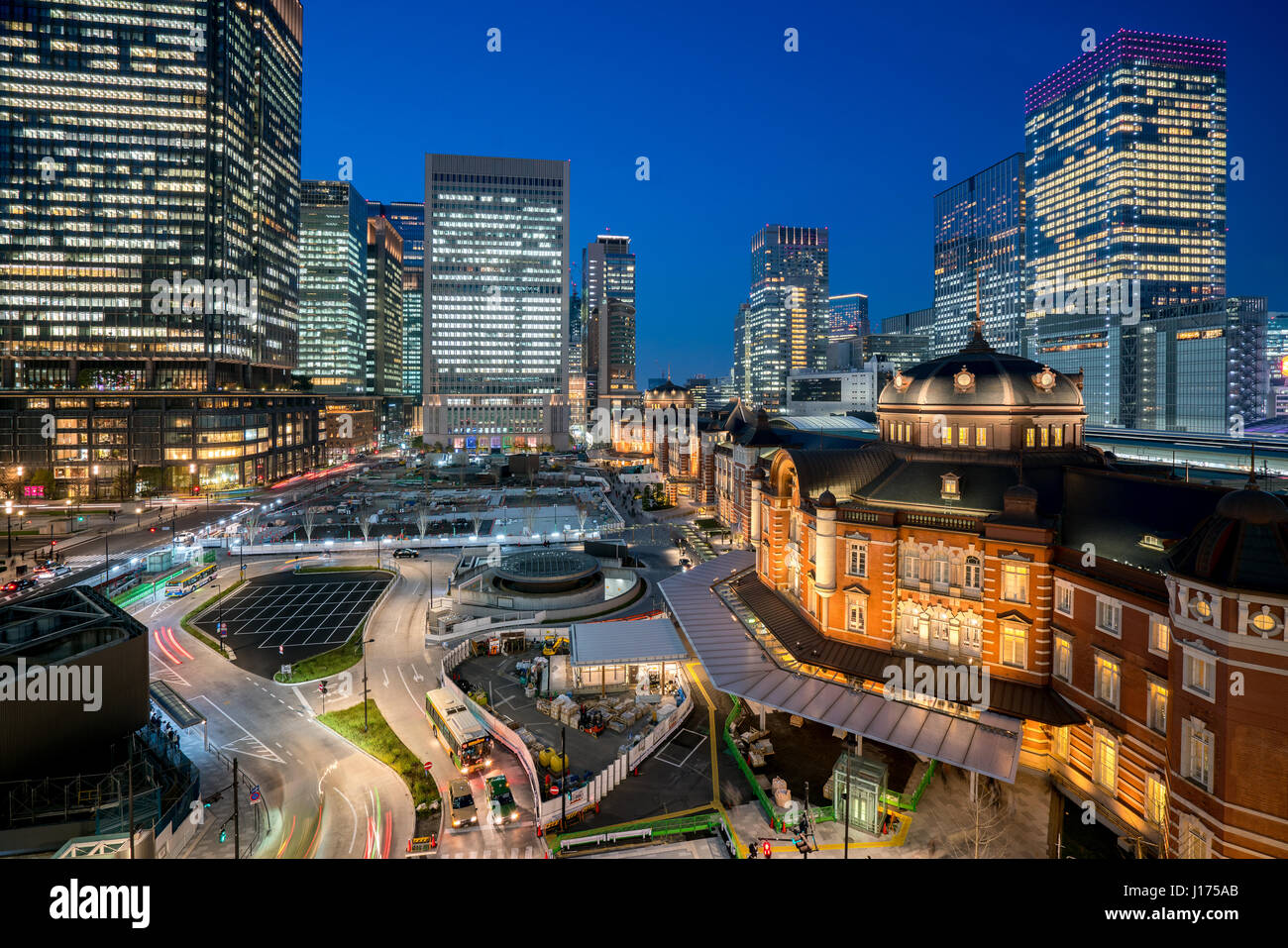 Tokyo railway station and Tokyo highrise building at twilight time in Tokyo, Japan. Stock Photo