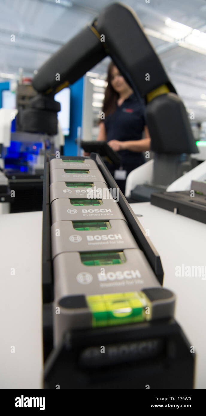 Stuttgart, Germany. 18th Apr, 2017. A Bosch employee operates an Apas  production assistant for demonstration purposes