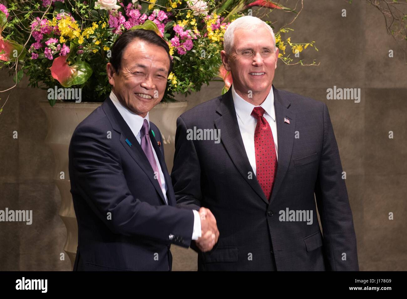 Tokyo, Japan. 18th Apr, 2017. U.S. Vice President Mike Pence, right, shakes hands with Japanese Finance Minister Taro Aso prior to the Japan-U.S. economic dialogue at the Prime Ministers Office April 18, 2017 in Tokyo, Japan. Pence is on his first official visit to Japan as vice president. Credit: Planetpix/Alamy Live News Stock Photo