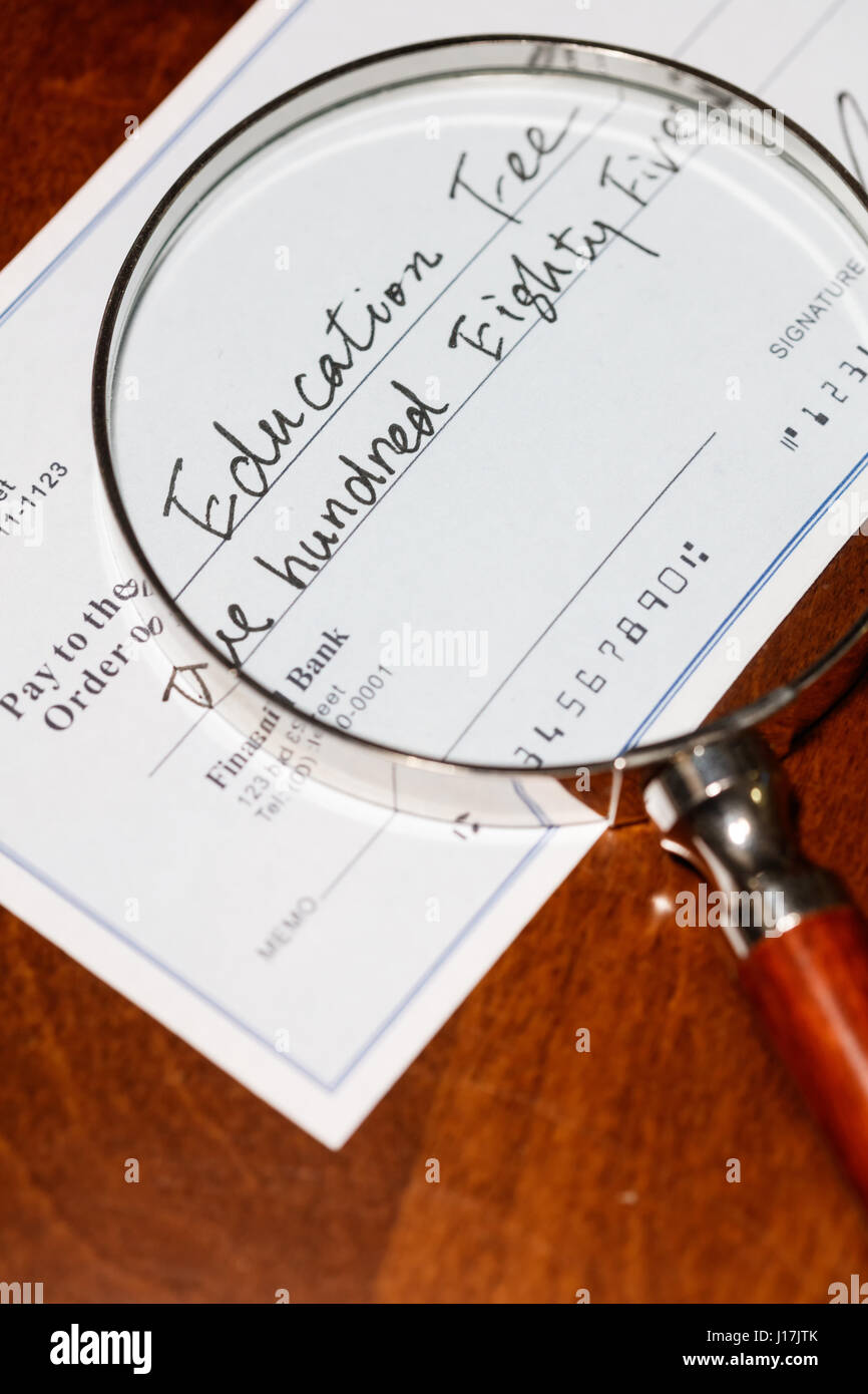 Fake cheque,  cheque for education fee, financial concept. Stock Photo