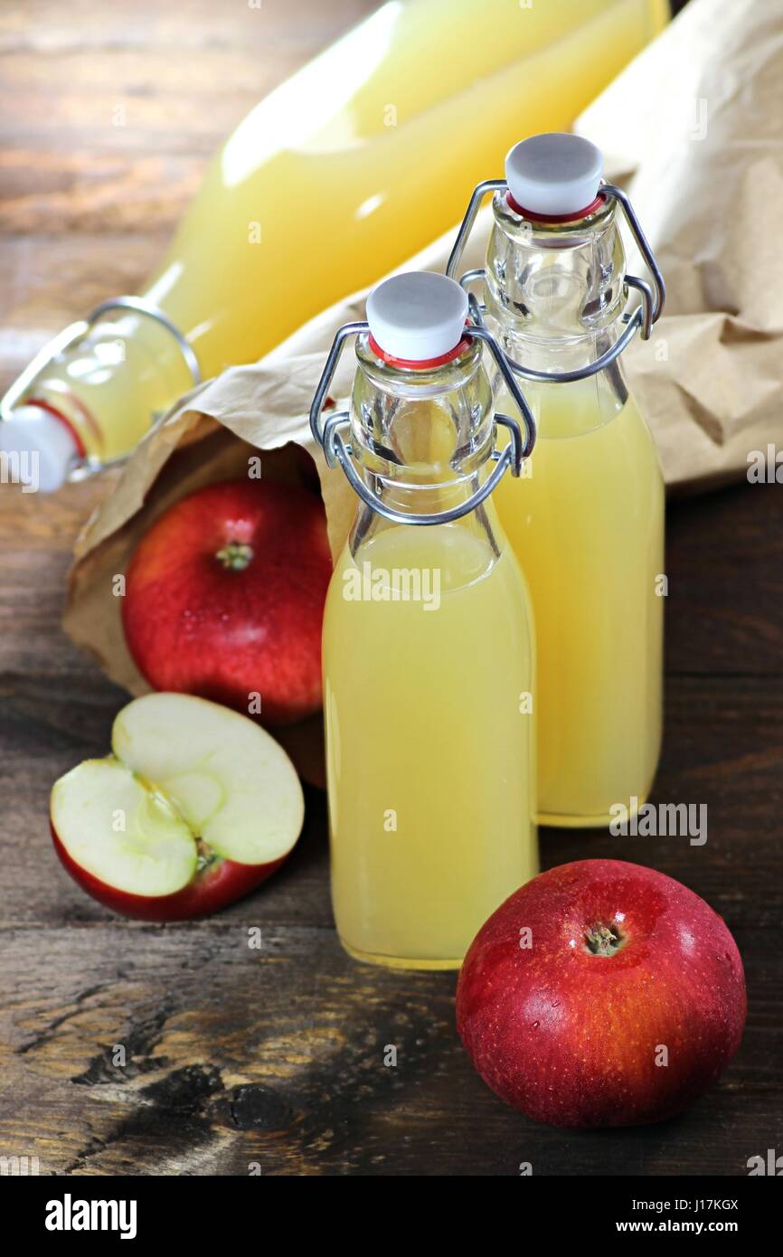 homemade apple juice on wooden background Stock Photo