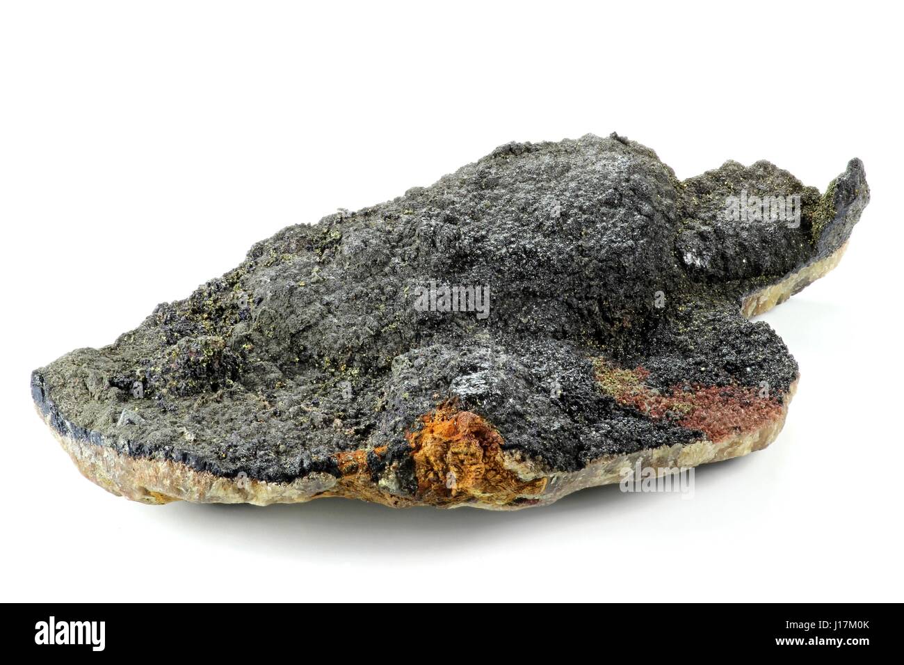 uraninite found in Oberschlema (Ore Mountains)/ Germany isolated on white background Stock Photo