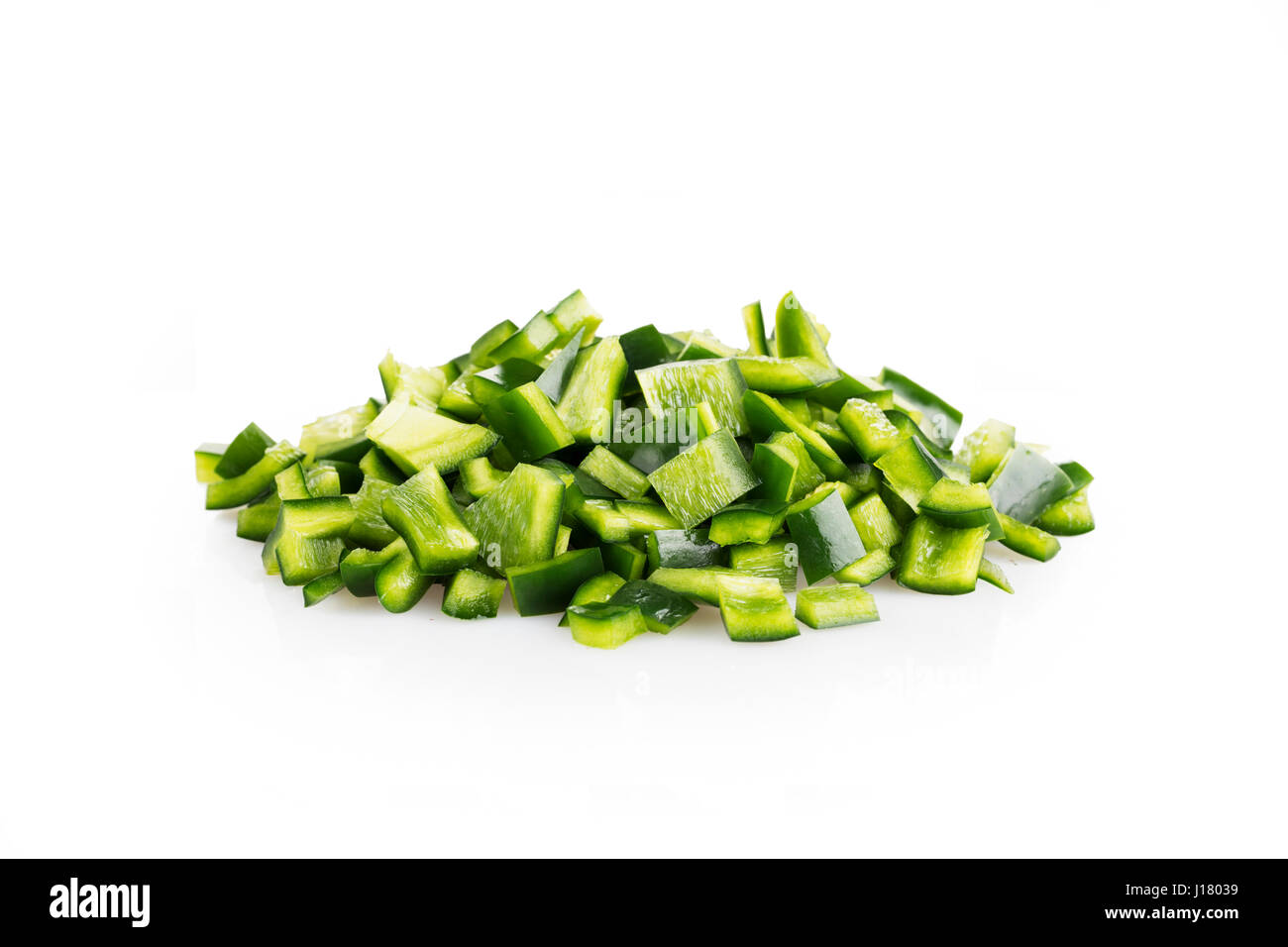Fresh chopped poblano peppers on white background with shadow. Stock Photo
