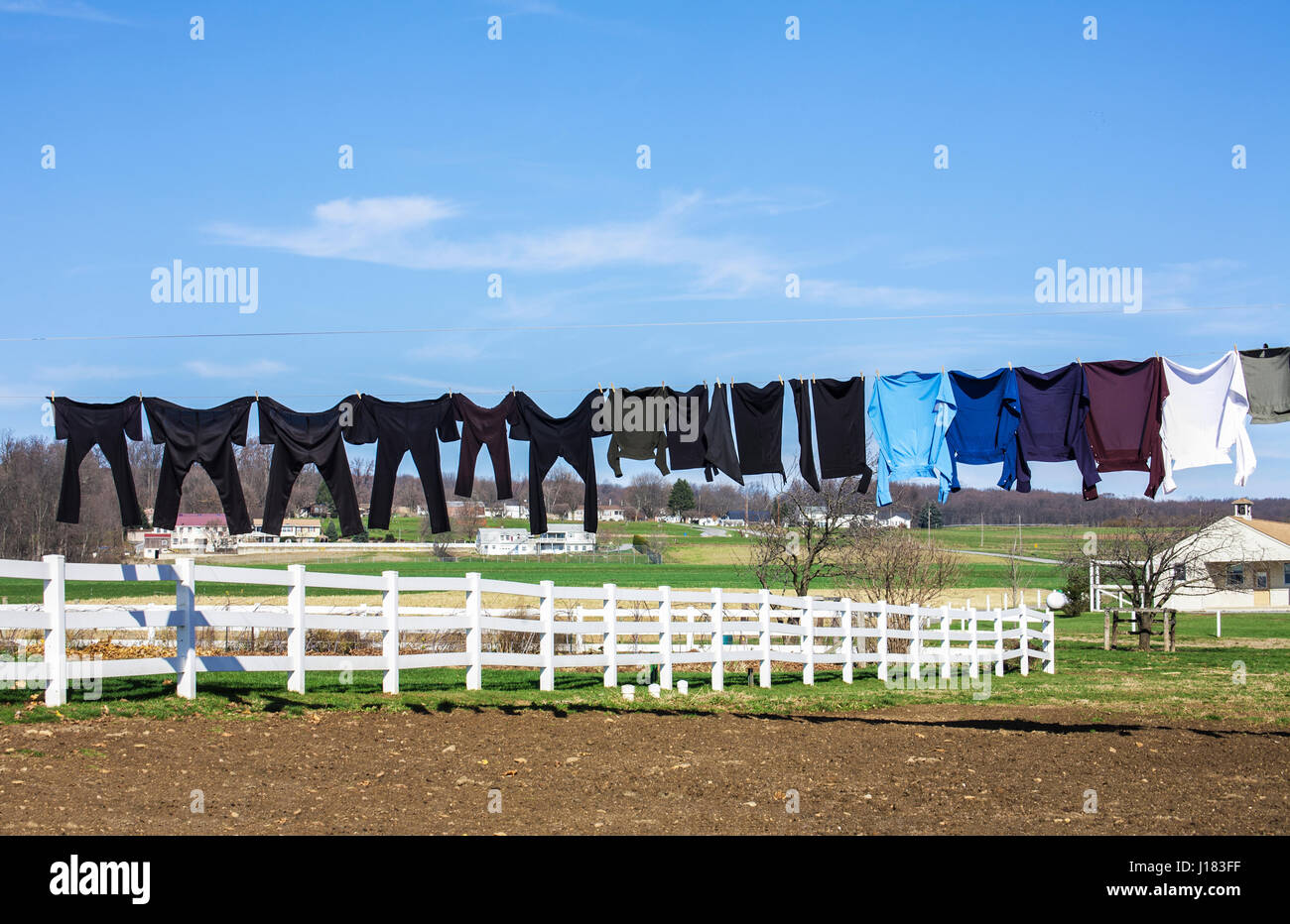 Amish clothing hanging on a clothesline against blue sky, Lancaster County, rural Pennsylvania, Pa images USA, America, Amish farmland Stock Photo
