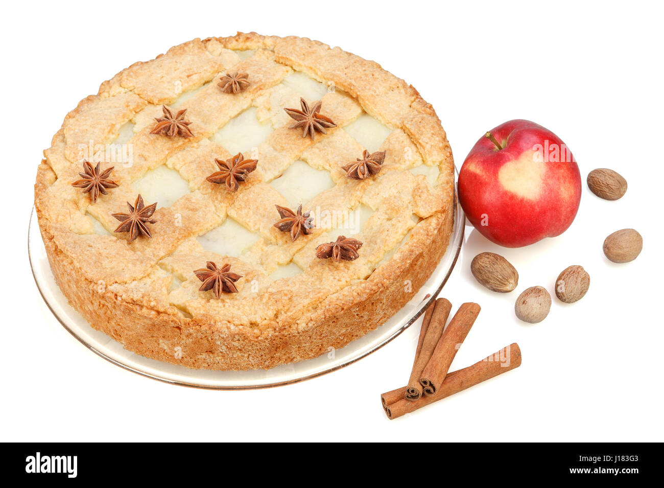 Apple pie with red apple, cinnamon, anise, nutmeg. Isolated on white