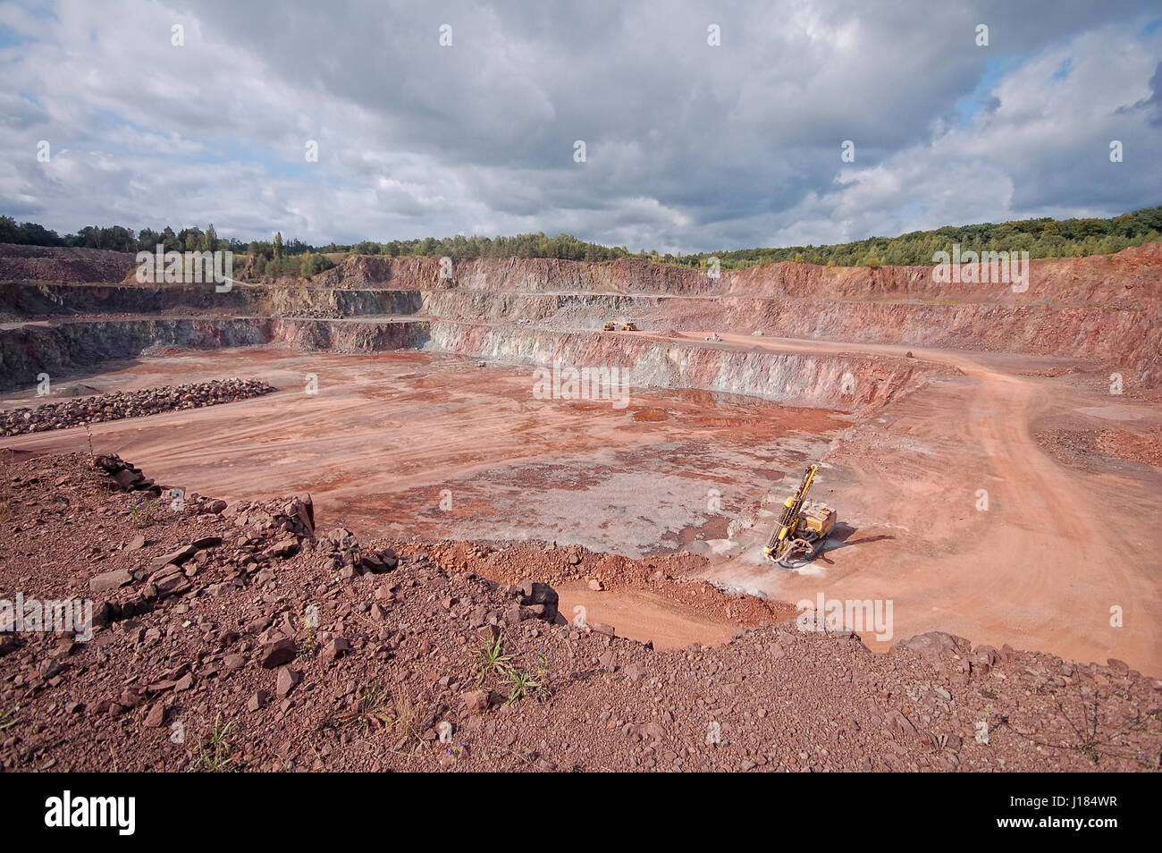quarry mine of porphyry rock. driller in a mine Stock Photo - Alamy
