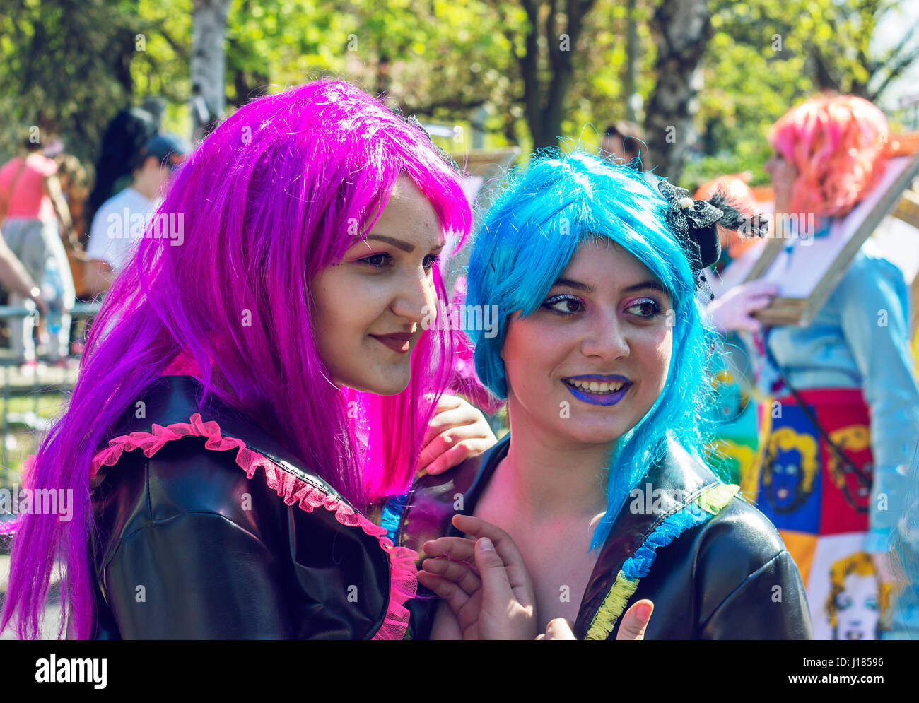 BELGRADE, SERBIA - APRIL 1st 2017: International carnival; Two girls wearing colorful wigs and costumes at 5th international carneval Stock Photo
