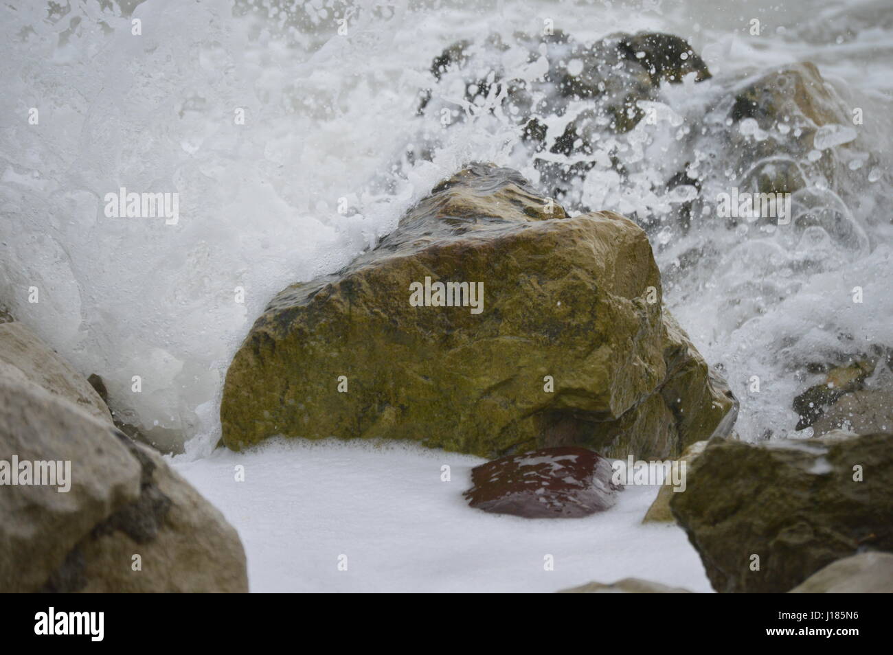 Rocks in the Surf Stock Photo - Alamy