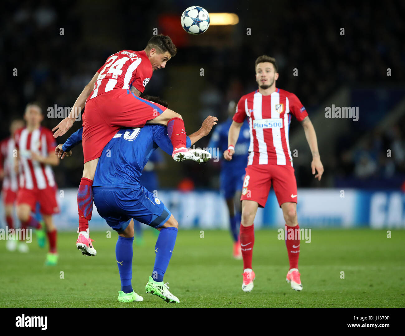 Atletico Madrid's Jose Maria Gimenez jumps over Leicester City's Leonardo Ulloa during the second leg of the UEFA Champions League quarter final match at the King Power Stadium, Leicester. Stock Photo