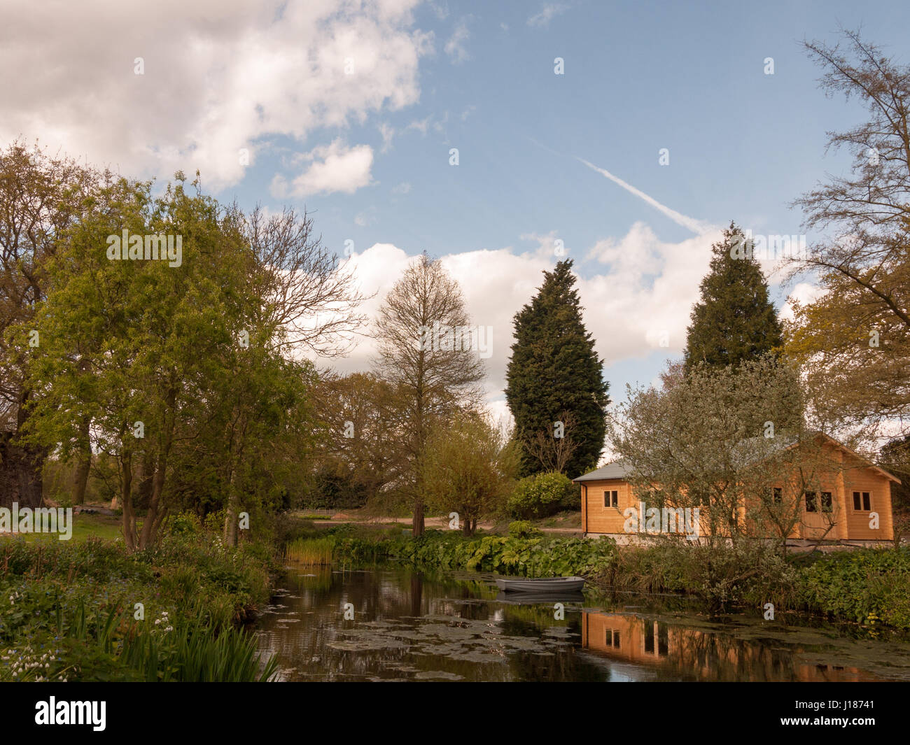 A Beautiful Garden With Trees and Plants and Lake in the Spring in the ...