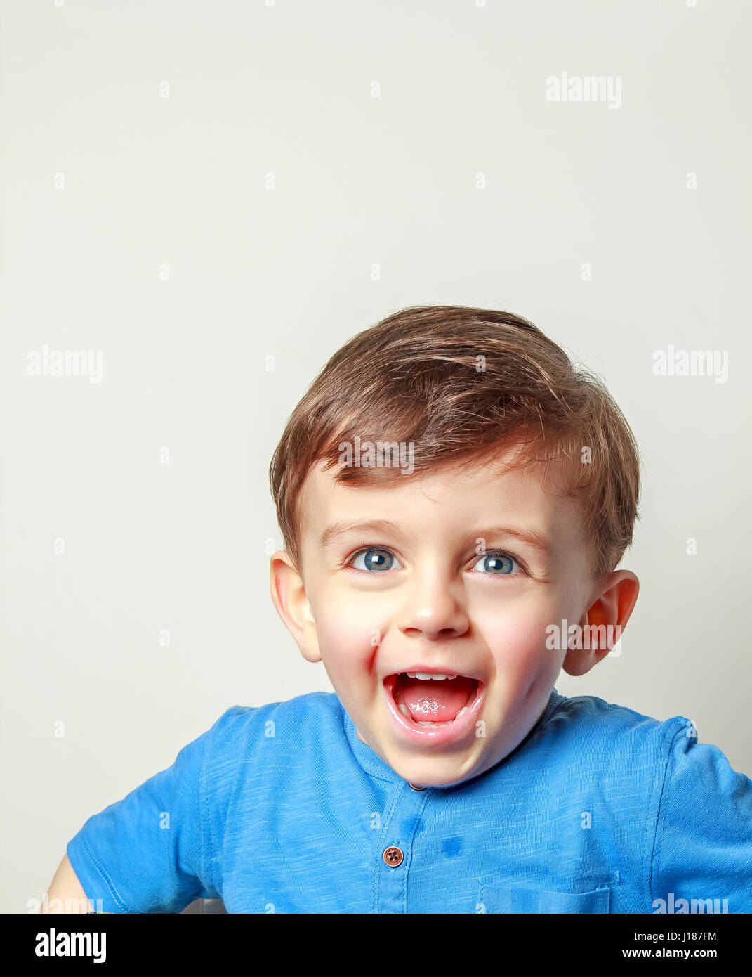 Happy child laughing at the camera Stock Photo - Alamy
