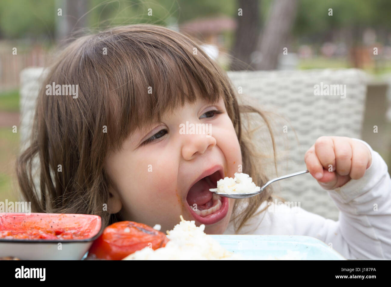 baby eating rice