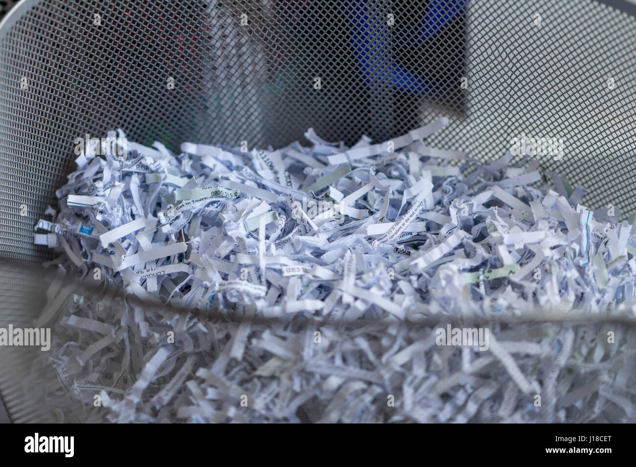 Shredded office paper in a basket Stock Photo Alamy