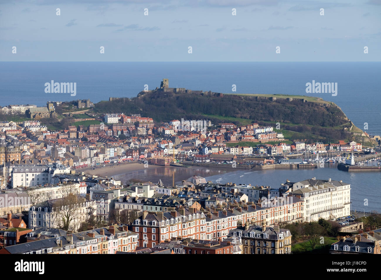 Scarborough is a resort town on England’s North Sea coast. Its 2 bays with sandy beaches are split by a headland bearing the 12th-century Scarborough  Stock Photo