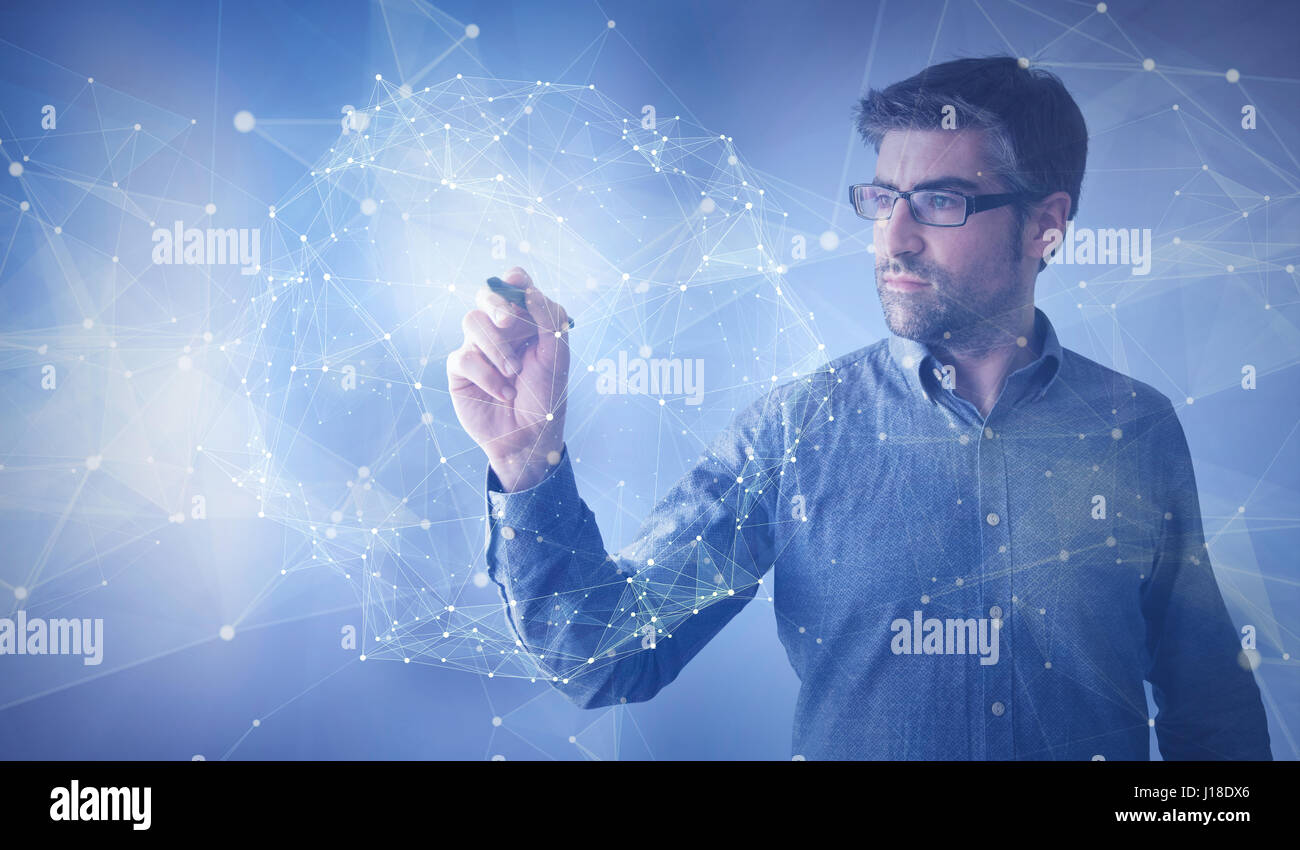 businessman touching linked balls Stock Photo