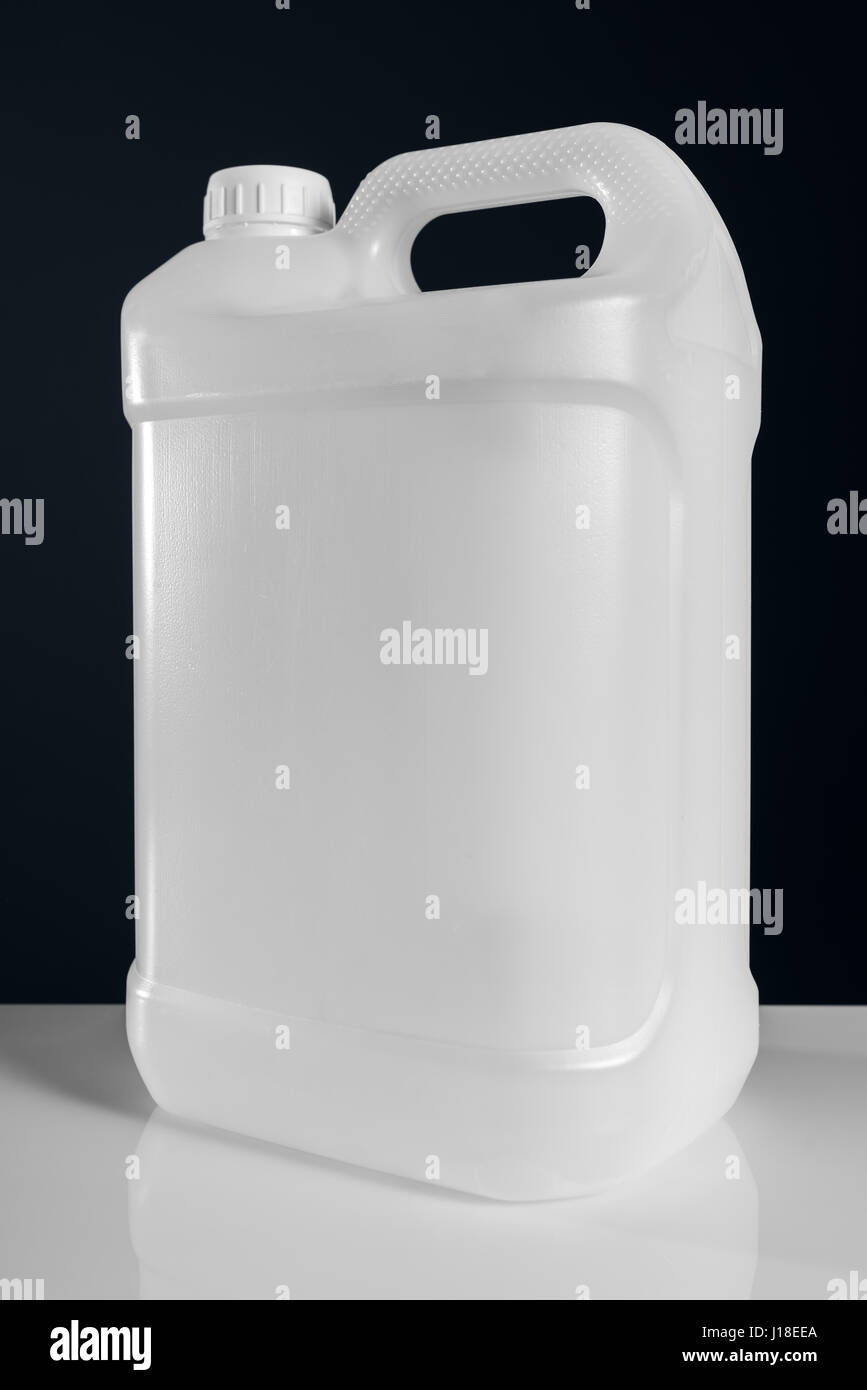 Unlabeled white plastic tank canister chemical liquid container as mock up object template Stock Photo