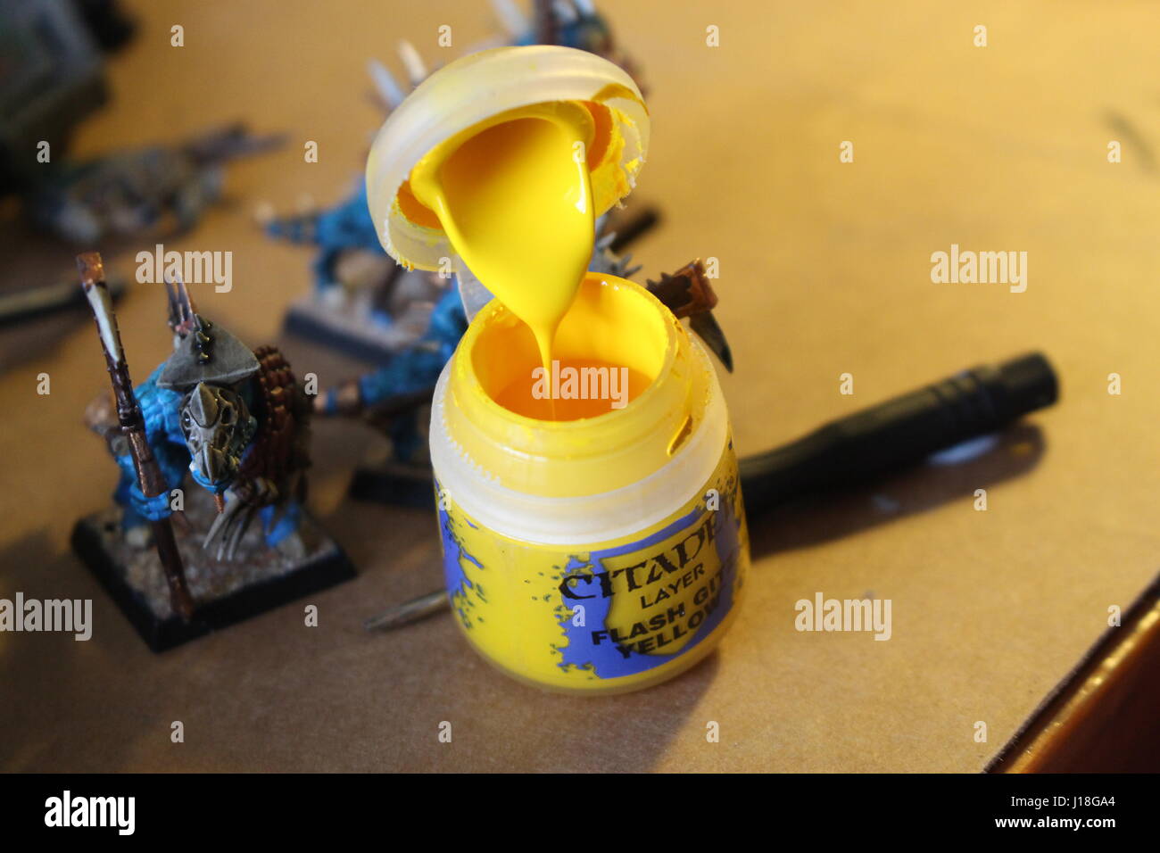 Painting some Warhammer figures. Stock Photo