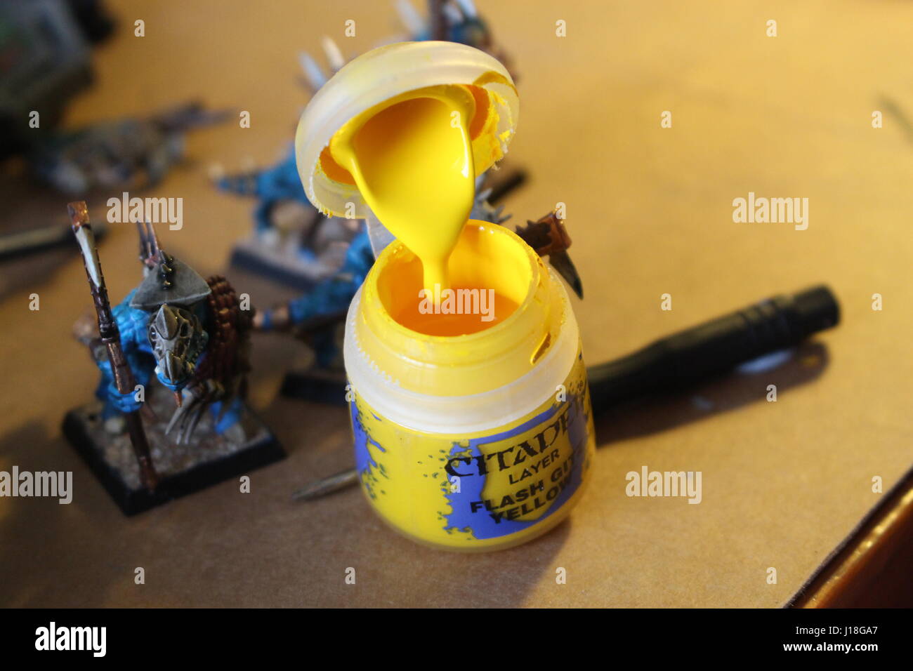 Painting some Warhammer figures. Stock Photo