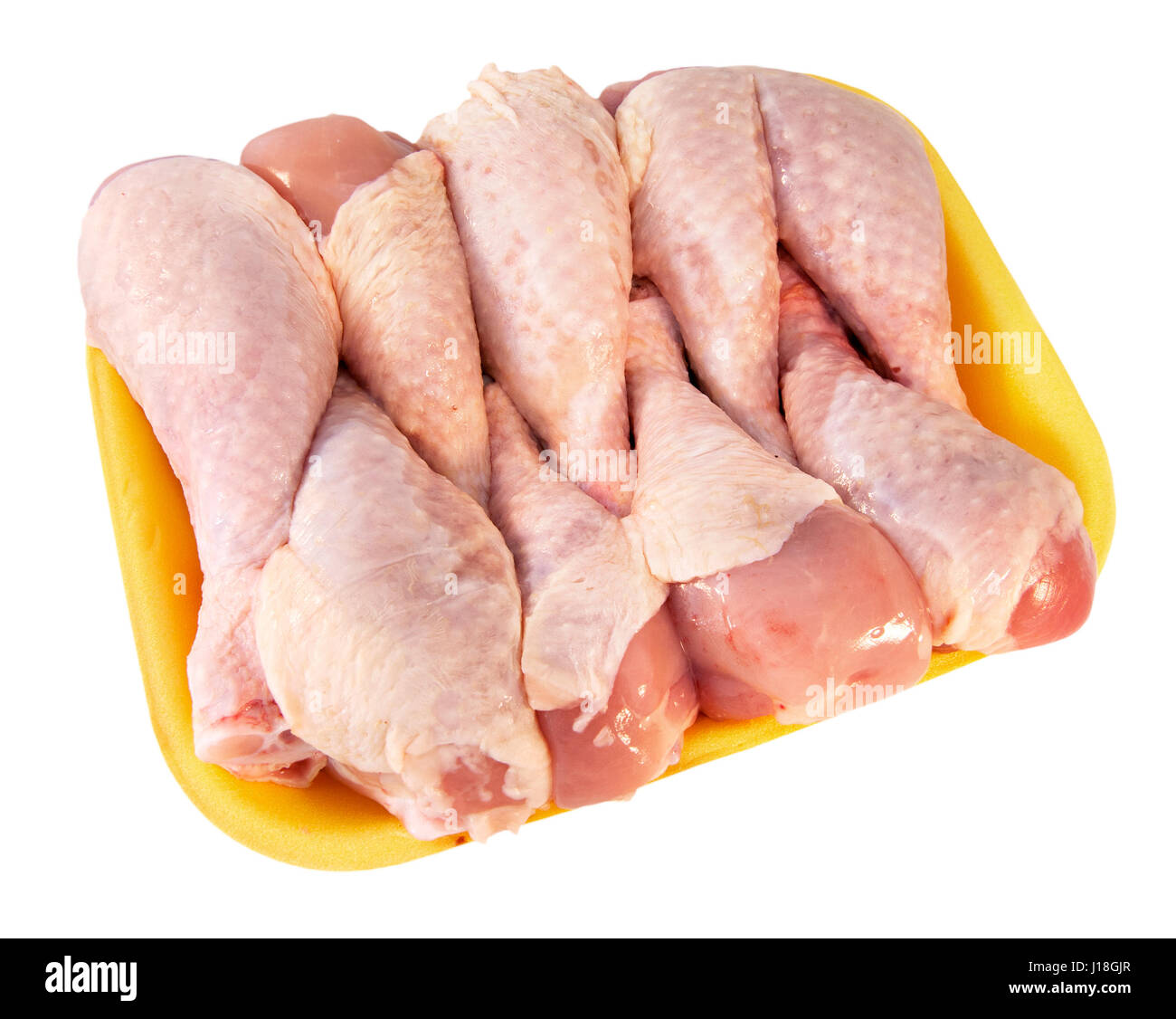 Download Chicken Legs In The Yellow Tray On The Light Background Stock Photo Alamy PSD Mockup Templates
