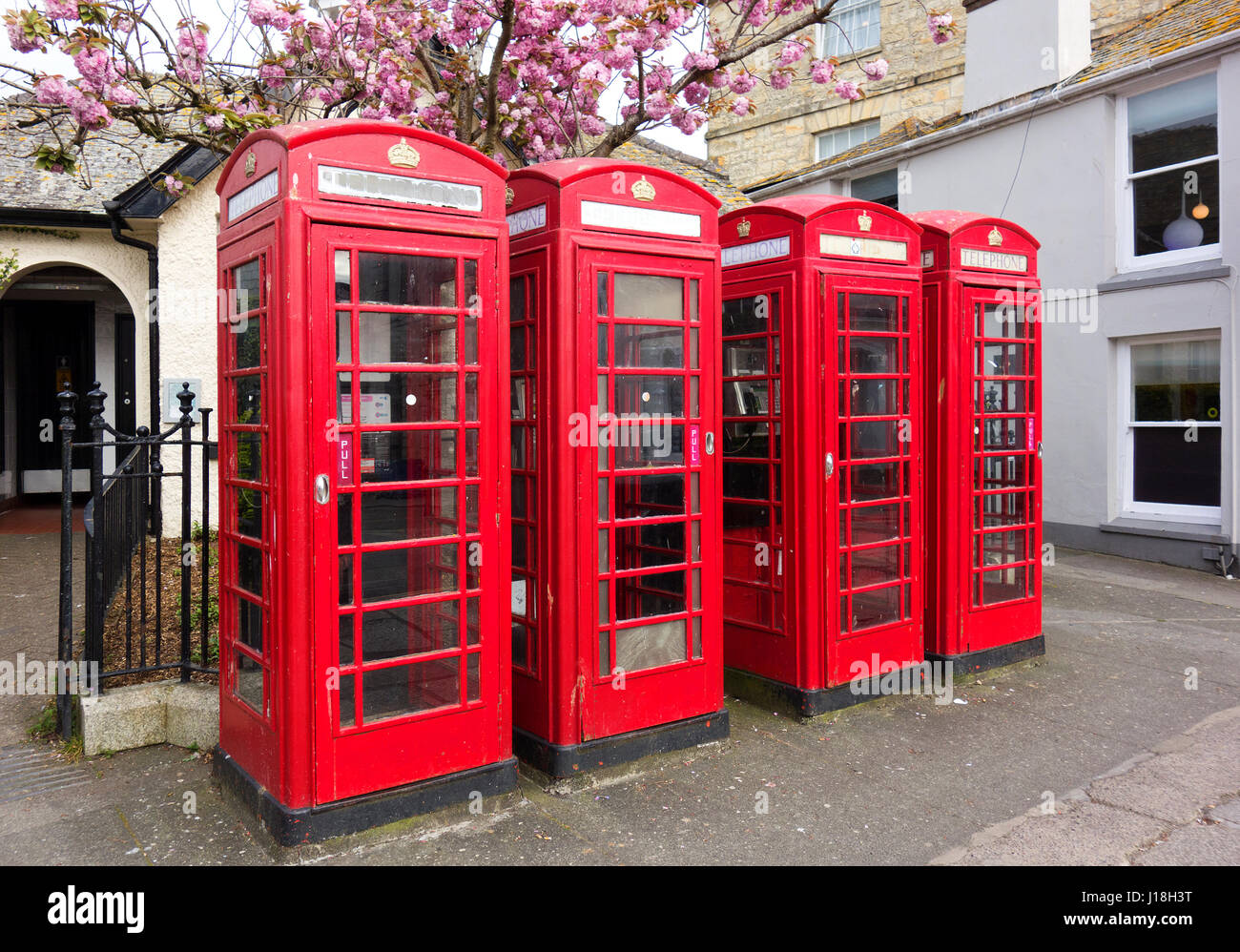 Four Classic Red English Telephone Boxes Stock Photo