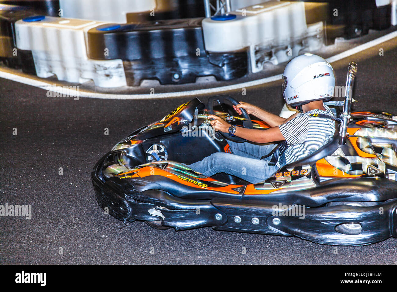 boy driving a kart inside the Karting Indoor circuit in Santa Cruz de