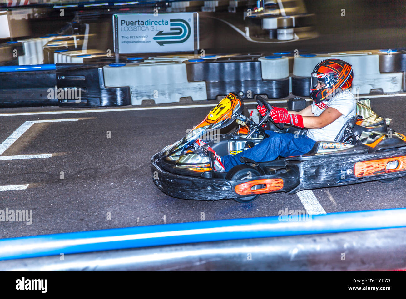 boy driving a kart inside the Karting Indoor circuit in Santa Cruz de
