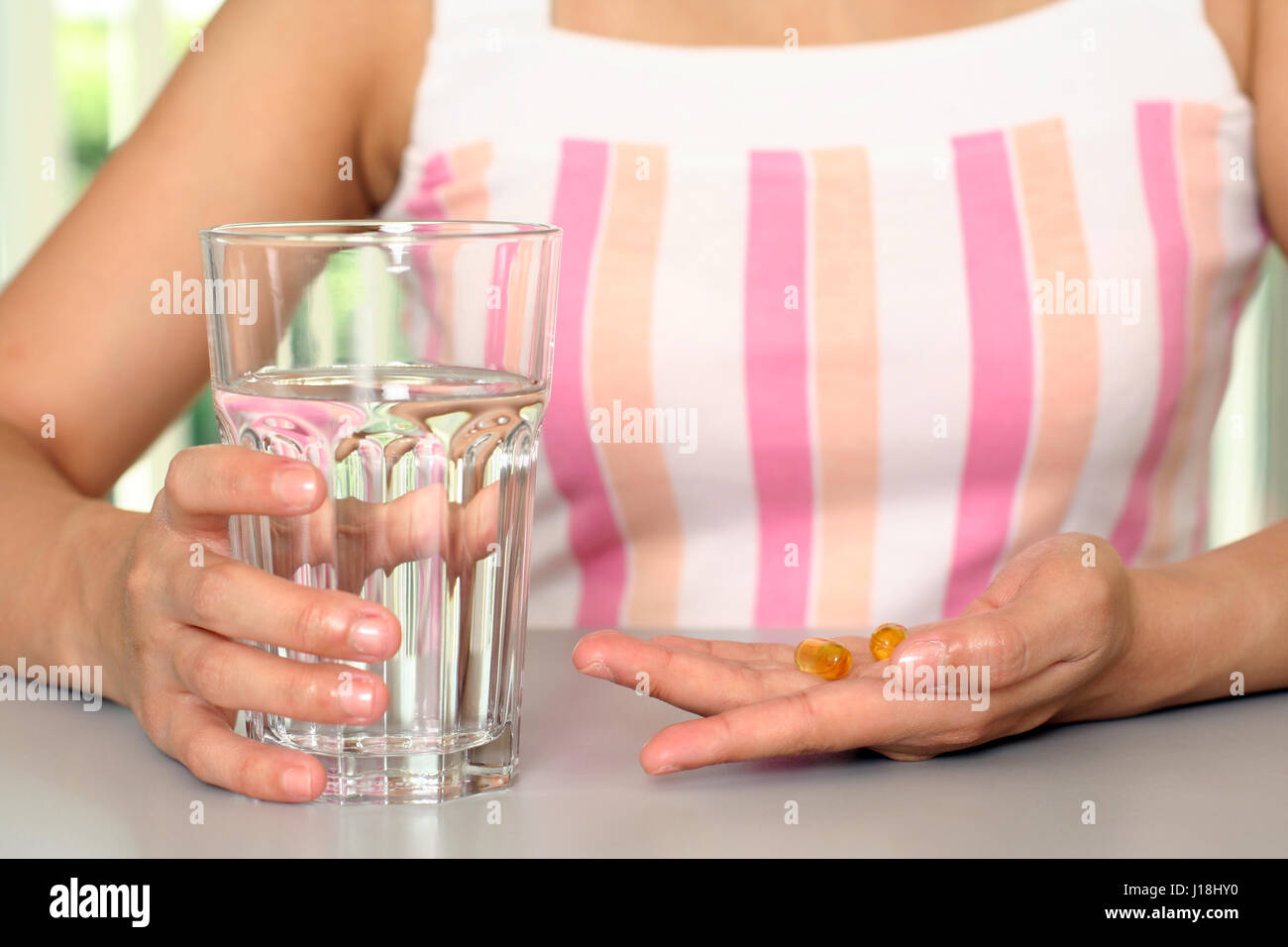 A woman taking vitamin Stock Photo Alamy