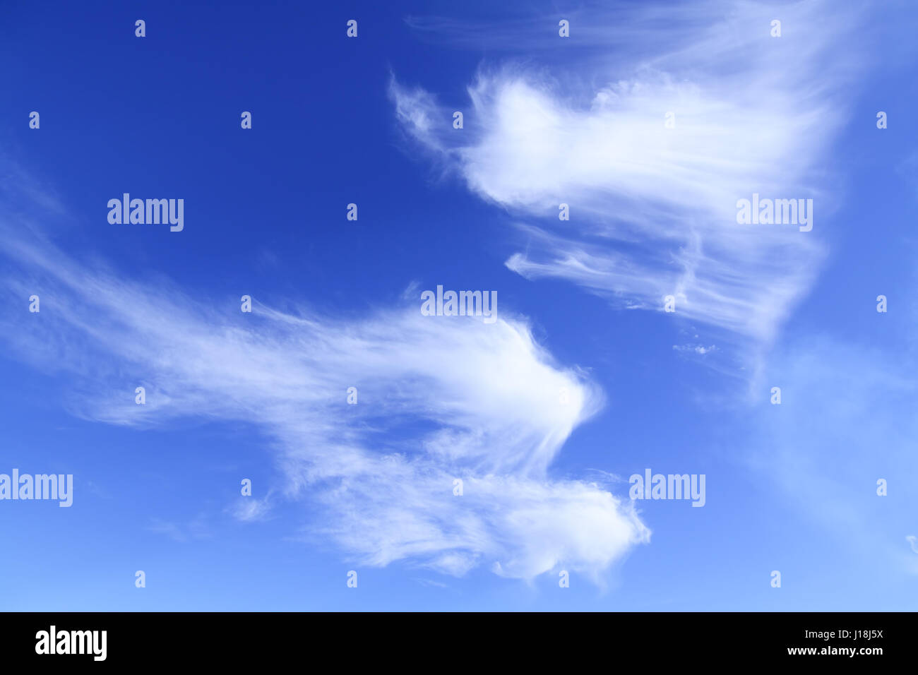 White clouds against blue sky Stock Photo - Alamy