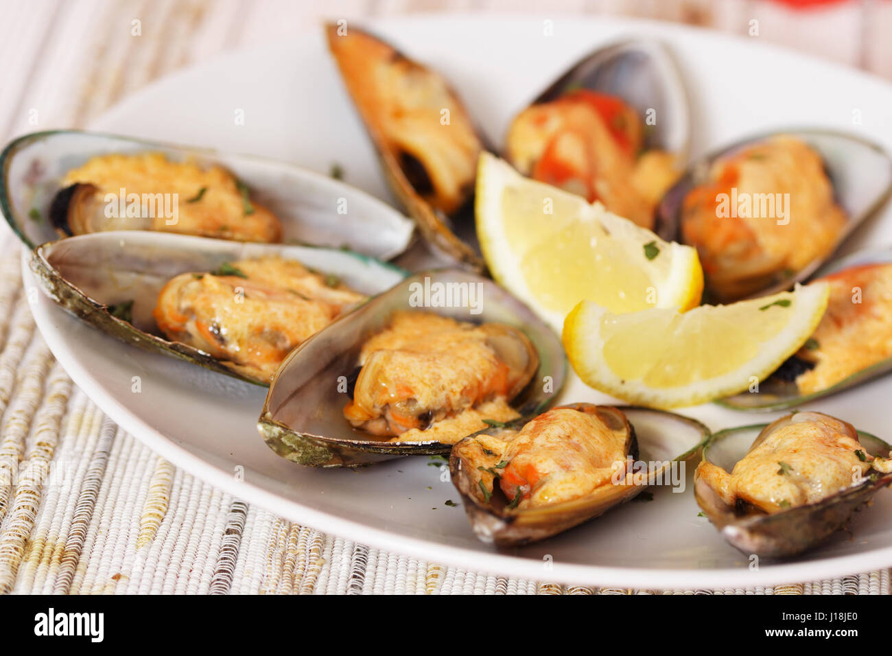 Baked mussels with mayonnaise Stock Photo Alamy