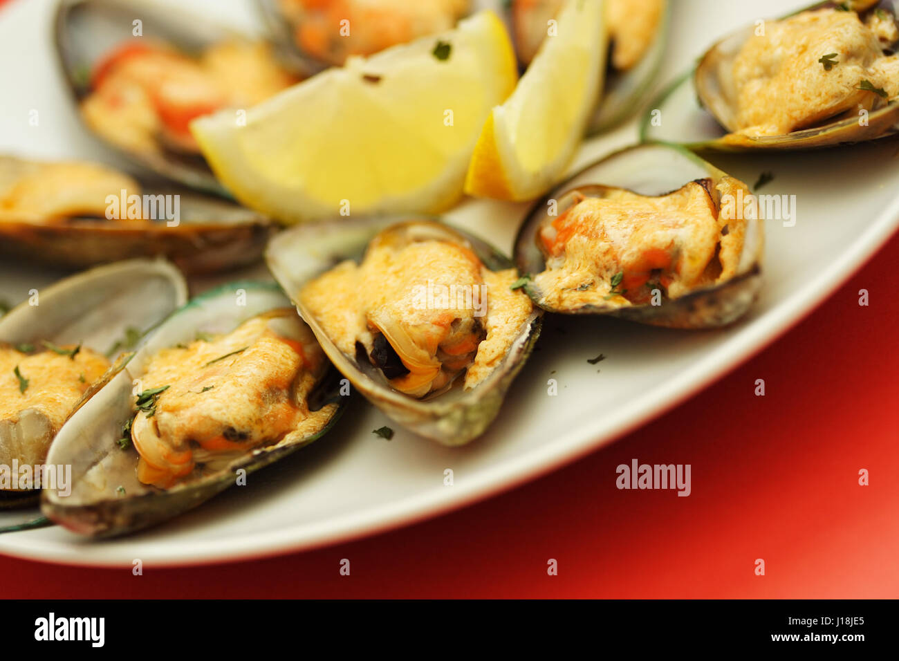 Baked mussels with mayonnaise Stock Photo Alamy