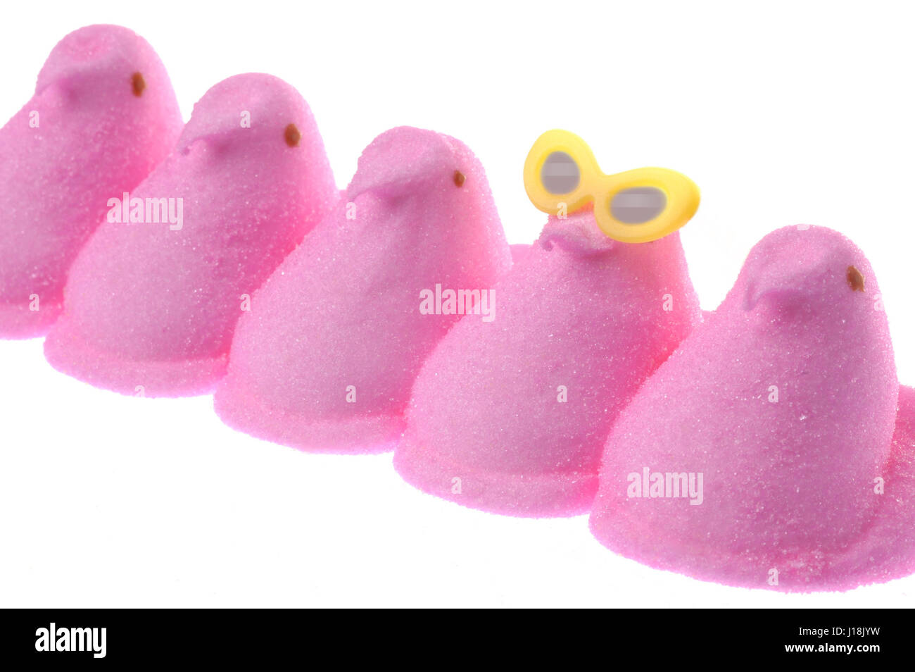 Peeps marshmallow chick candy, classic springtime or Easter treat. One fun, individual peep is wearing sunglasses Stock Photo