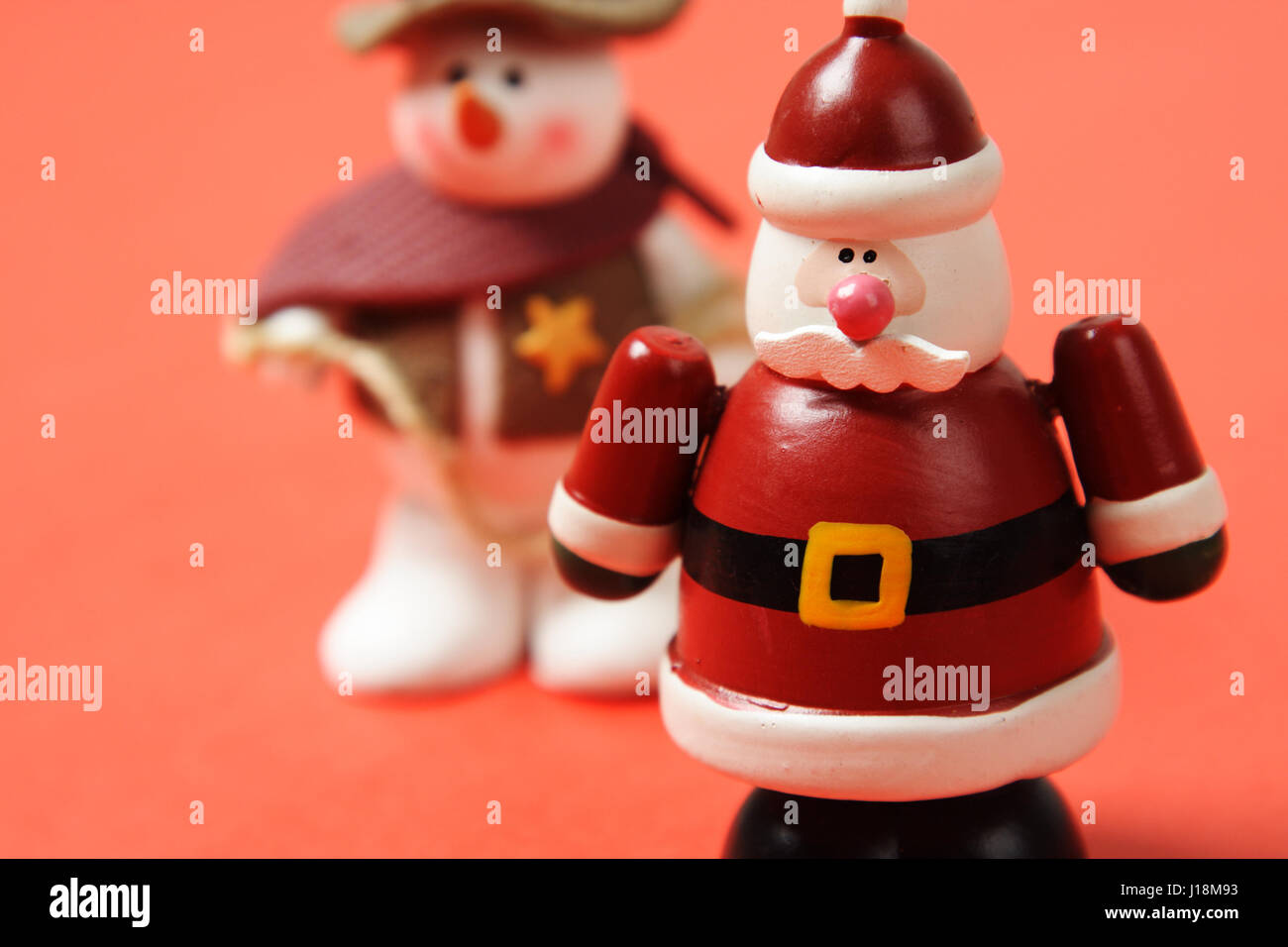 A toy figure of santa claus and snowman Stock Photo - Alamy