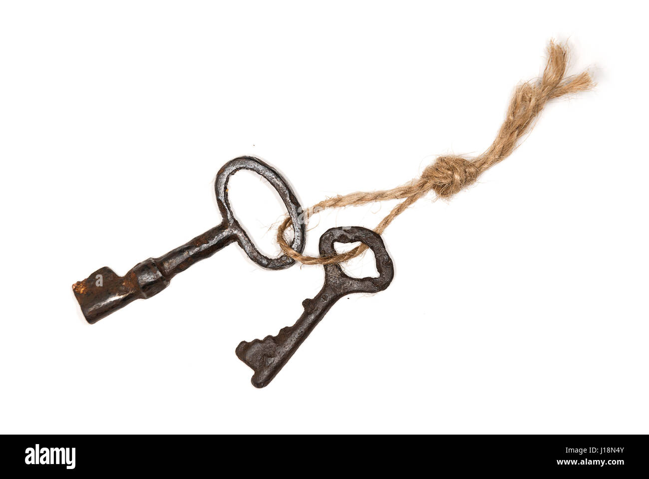 Bunch of old keys on a rope on white Stock Photo Alamy