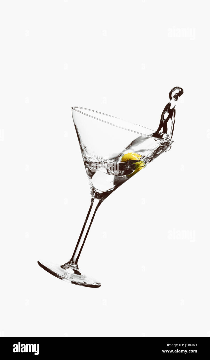 Martini glass and olive, splashing drink, white background and copy