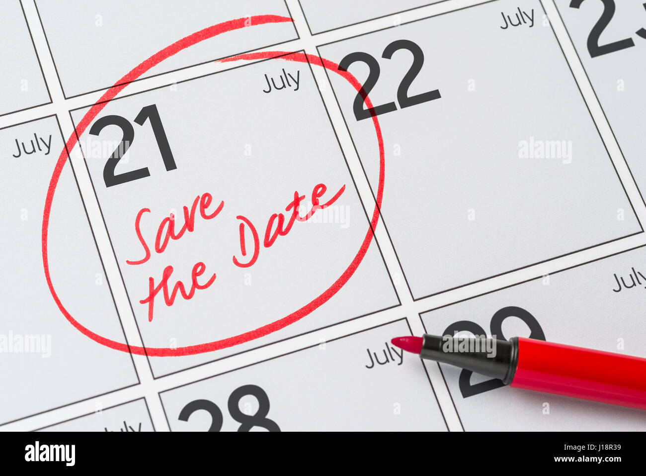 Save the Date written on a calendar - July 21 Stock Photo - Alamy