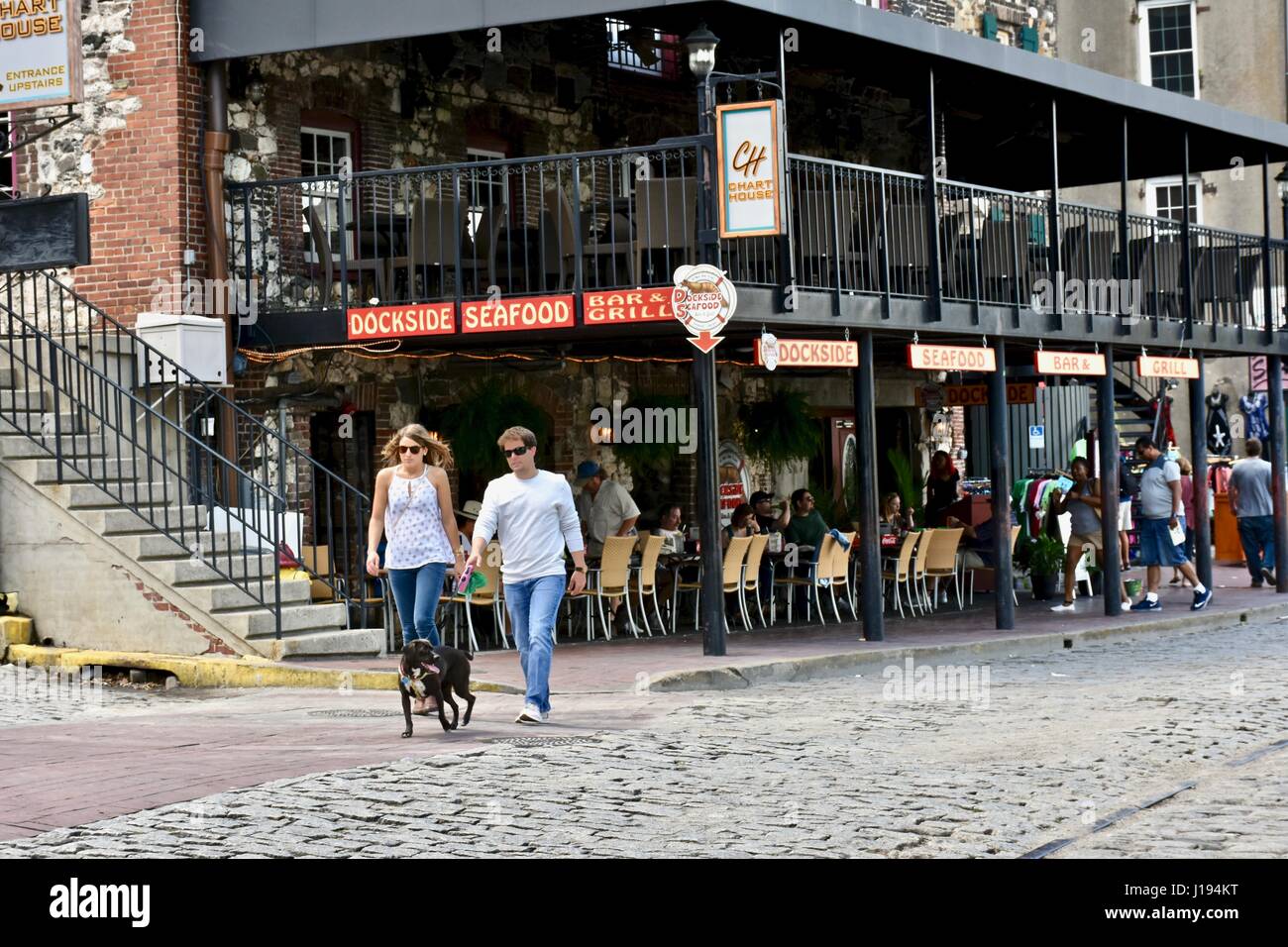 Tourists exploring the Savannah riverfront looking at different restaurants Savannah, Georgia Stock Photo