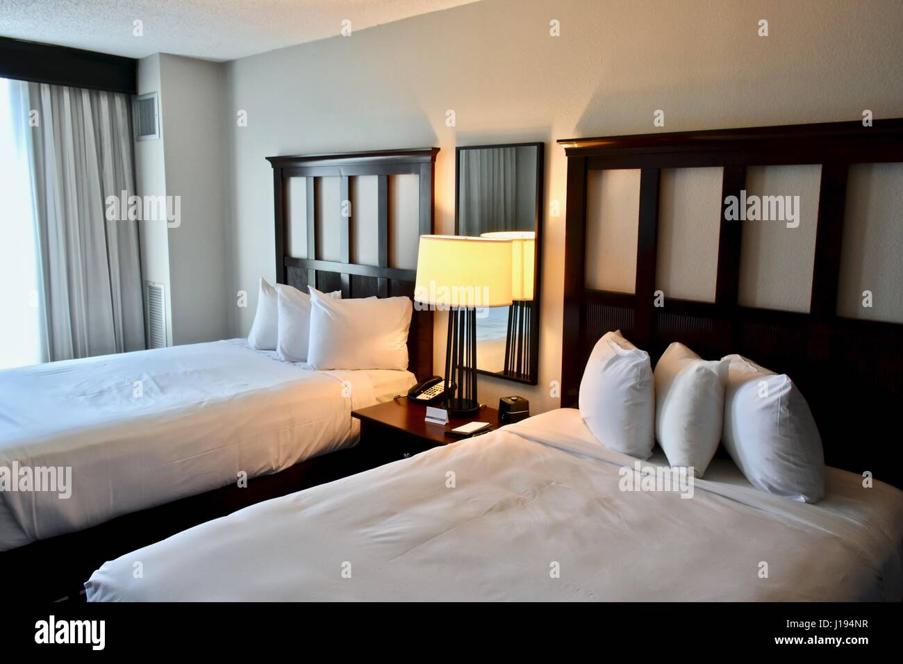Modern Hotel Room With Two Double Beds Stock Photo