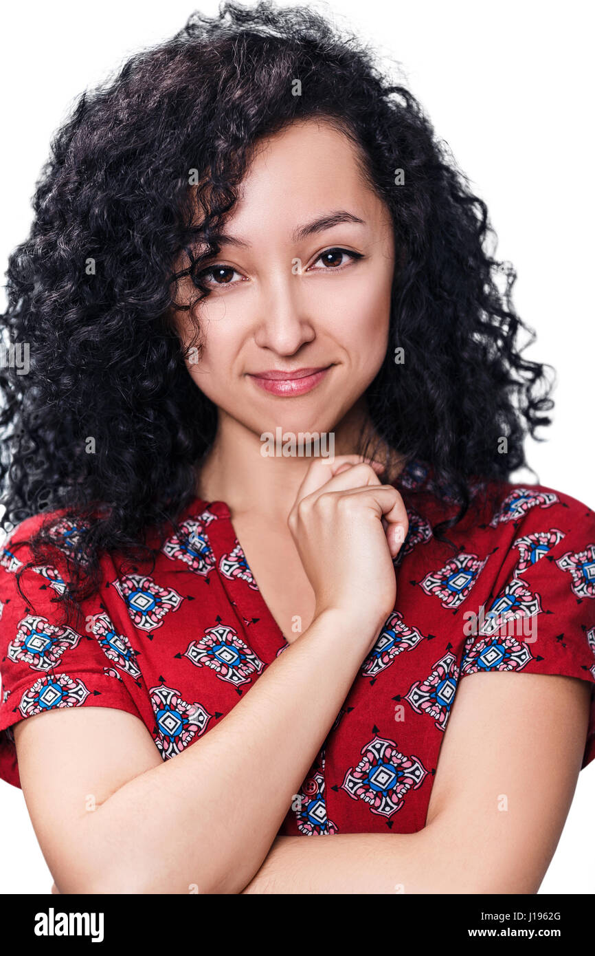 Young woman smiling with curly black hair Stock Photo