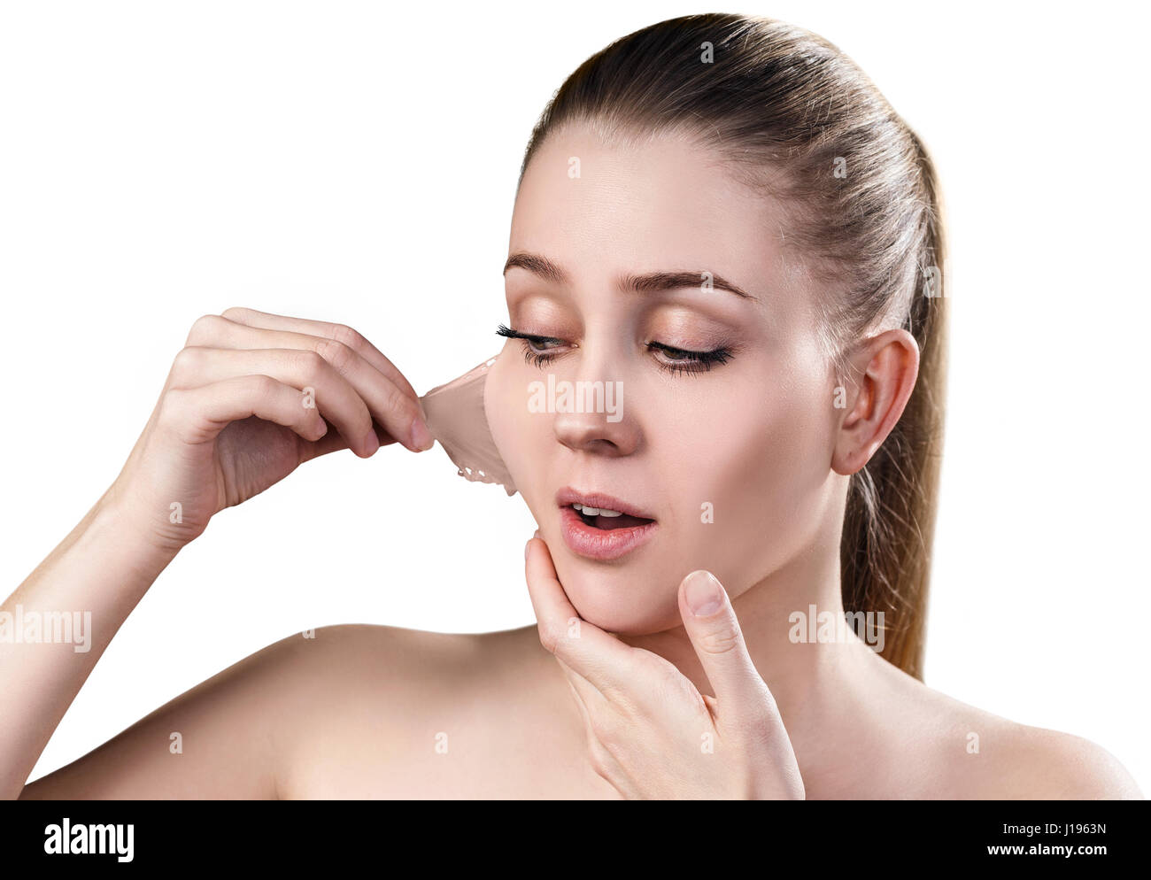 Woman remove her old dry skin from face. Stock Photo